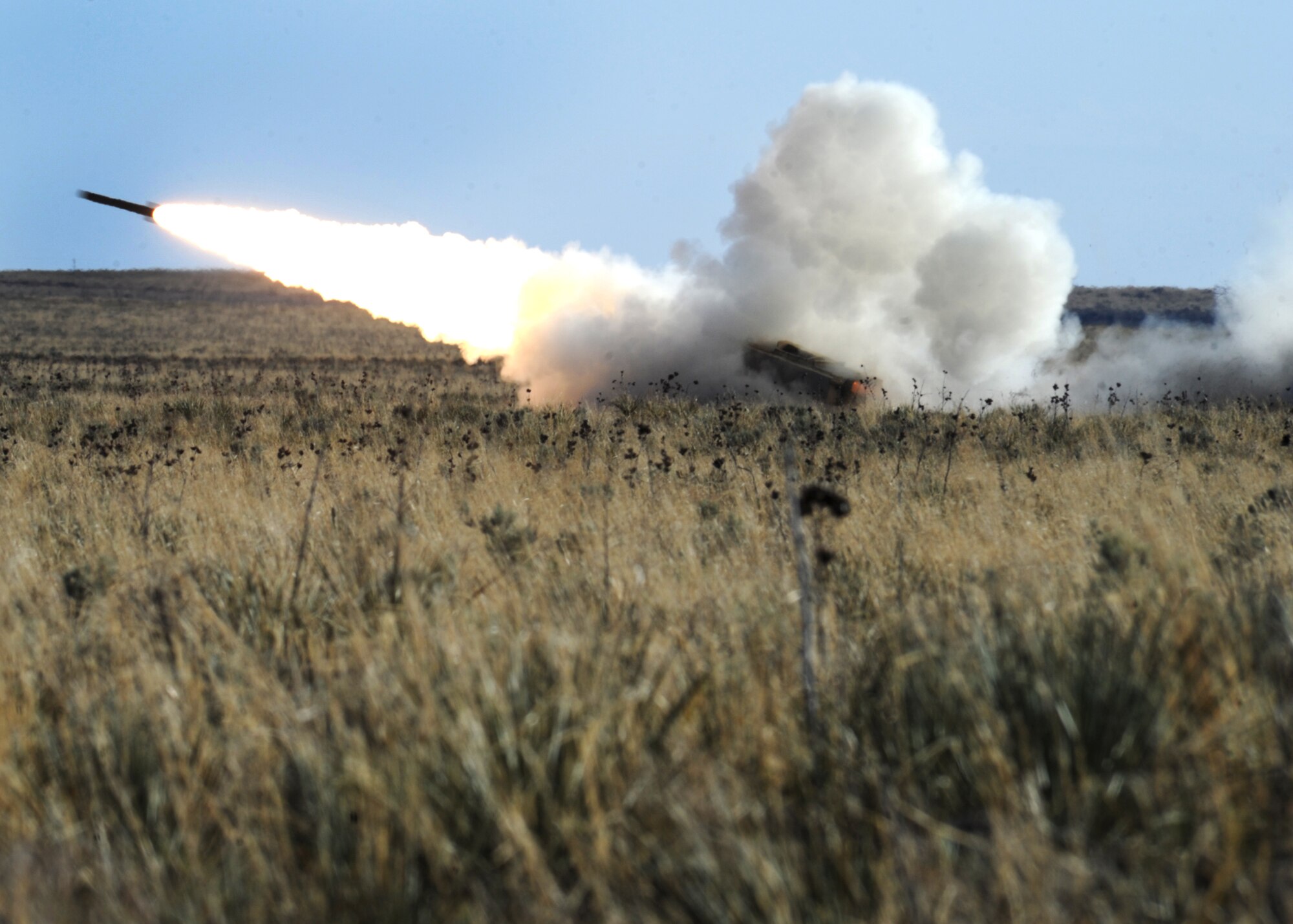 A rocket fires during High Mobility Artillery Rocket System training April 30, 2014 at Melrose Air Force Range, N.M. The training consisted of firing off 24 rockets that broke the sound barrier causing mild sonic booms. (U.S. Air Force photo/Senior Airman Ericka Engblom)