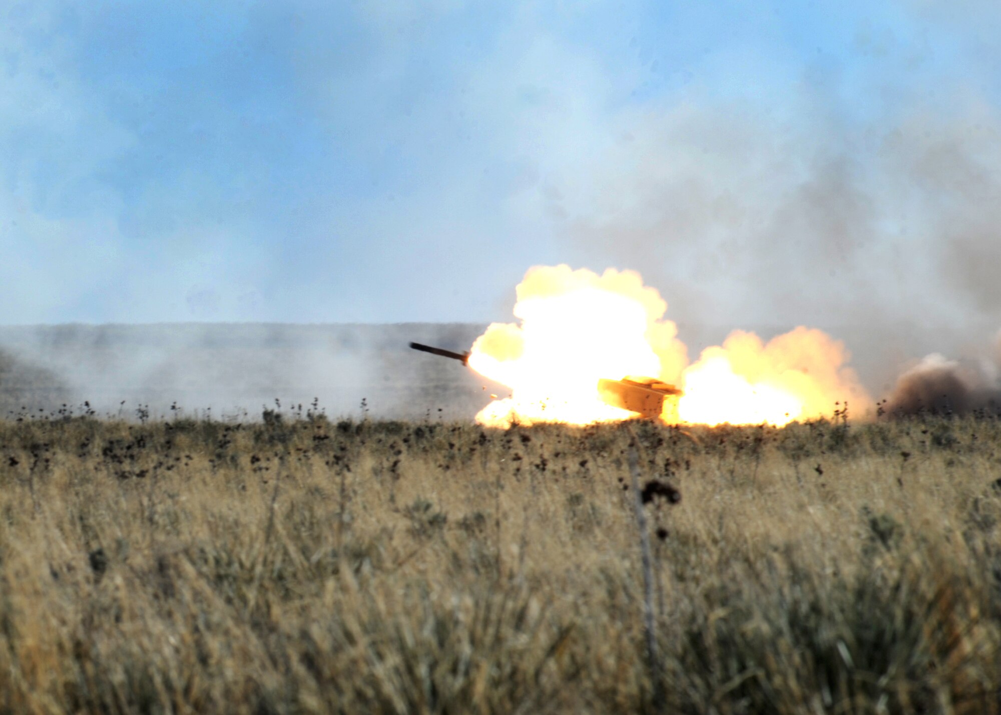A rocket fires during High Mobility Artillery Rocket System training April 30, 2014 at Melrose Air Force Range, N.M. The training consisted of firing off 24 rockets that broke the sound barrier causing mild sonic booms. (U.S. Air Force photo/Senior Airman Ericka Engblom)