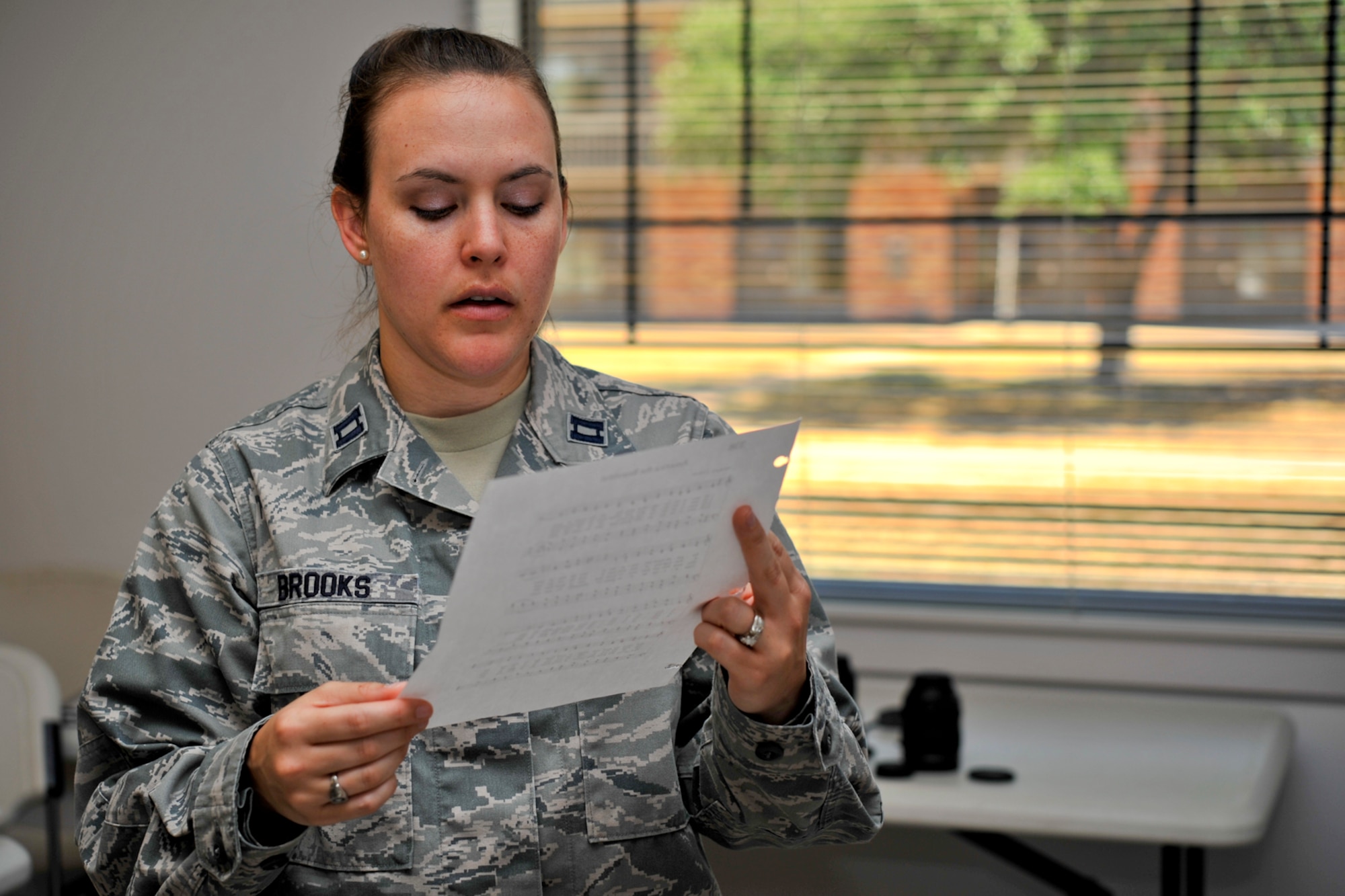 GOODFELLOW AIR FORCE BASE, Texas – Capt. Heather M. Brooks, 17th Medical Operations Squadron general dentist, practices singing the Star Spangled Banner at the Taylor Chapel here May 6. Brooks is a member of the base singing group Patriotic Blue. (U.S. Air Force photo/ Airman 1st Class Devin Boyer)