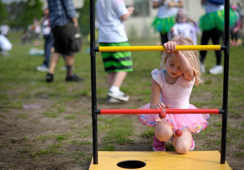 A child from Team Ramstein plays a game after participating in the Keystone Color Run with her family on Ramstein Air Base, Germany, May 10, 2014. More than 800 participants came out for the family 5K to raise awareness for teen suicide. Proceeds were donated to the Kristen Brooks Hope Center, a program dedicated to providing support for youth and veterans experiencing risk factors for suicide. (U.S. Air Force photo/Staff Sgt. Sara Keller)