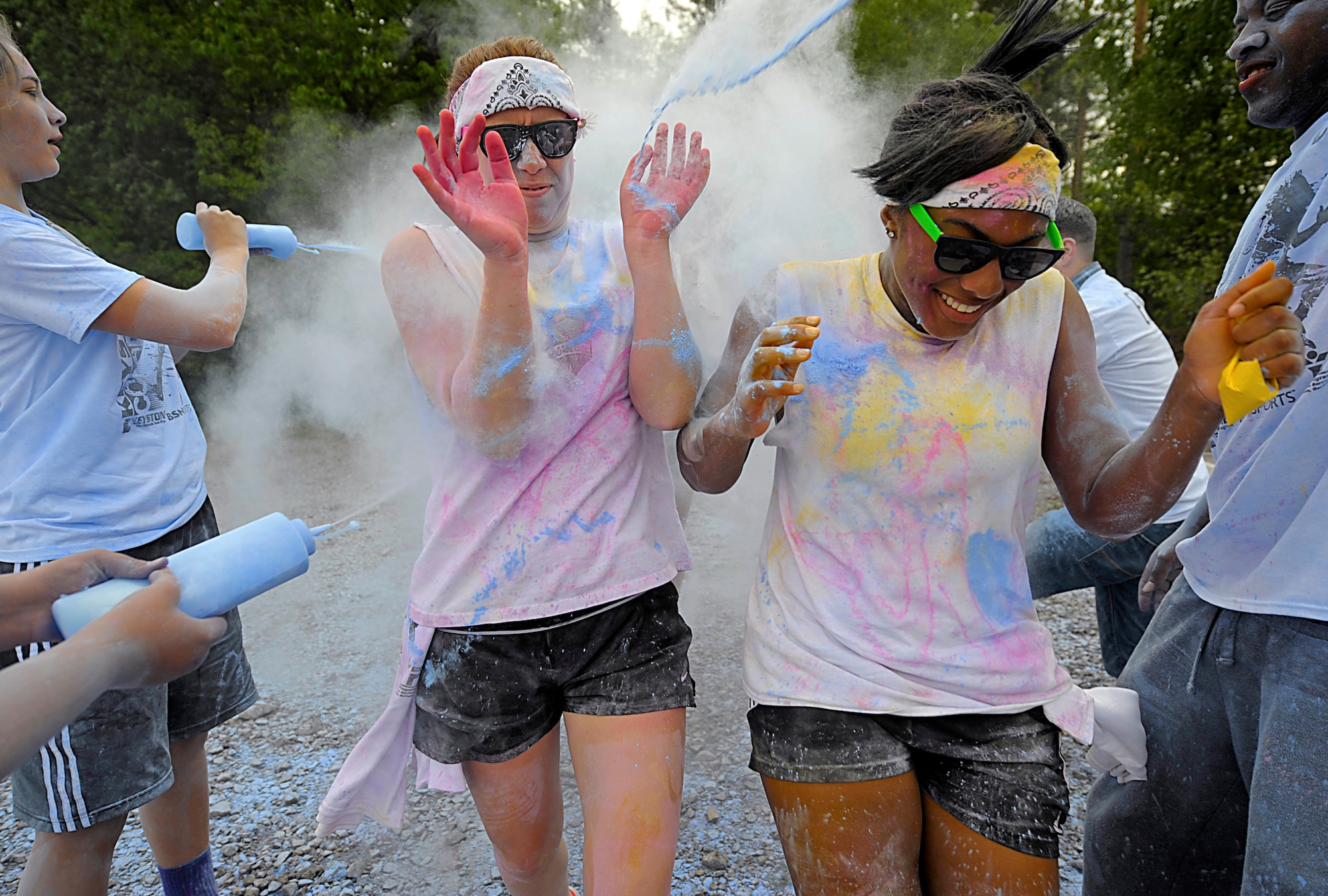 Members of Team Ramstein run through the final color station during the Keystone Color Run on Ramstein Air Base, Germany, May 10, 2014. More than 800 participants came out for the family 5K to raise awareness for teen suicide. Proceeds were donated to a program dedicated to providing support for youth and veterans experiencing risk factors for suicide. (U.S. Air Force photo/Staff Sgt. Sara Keller)