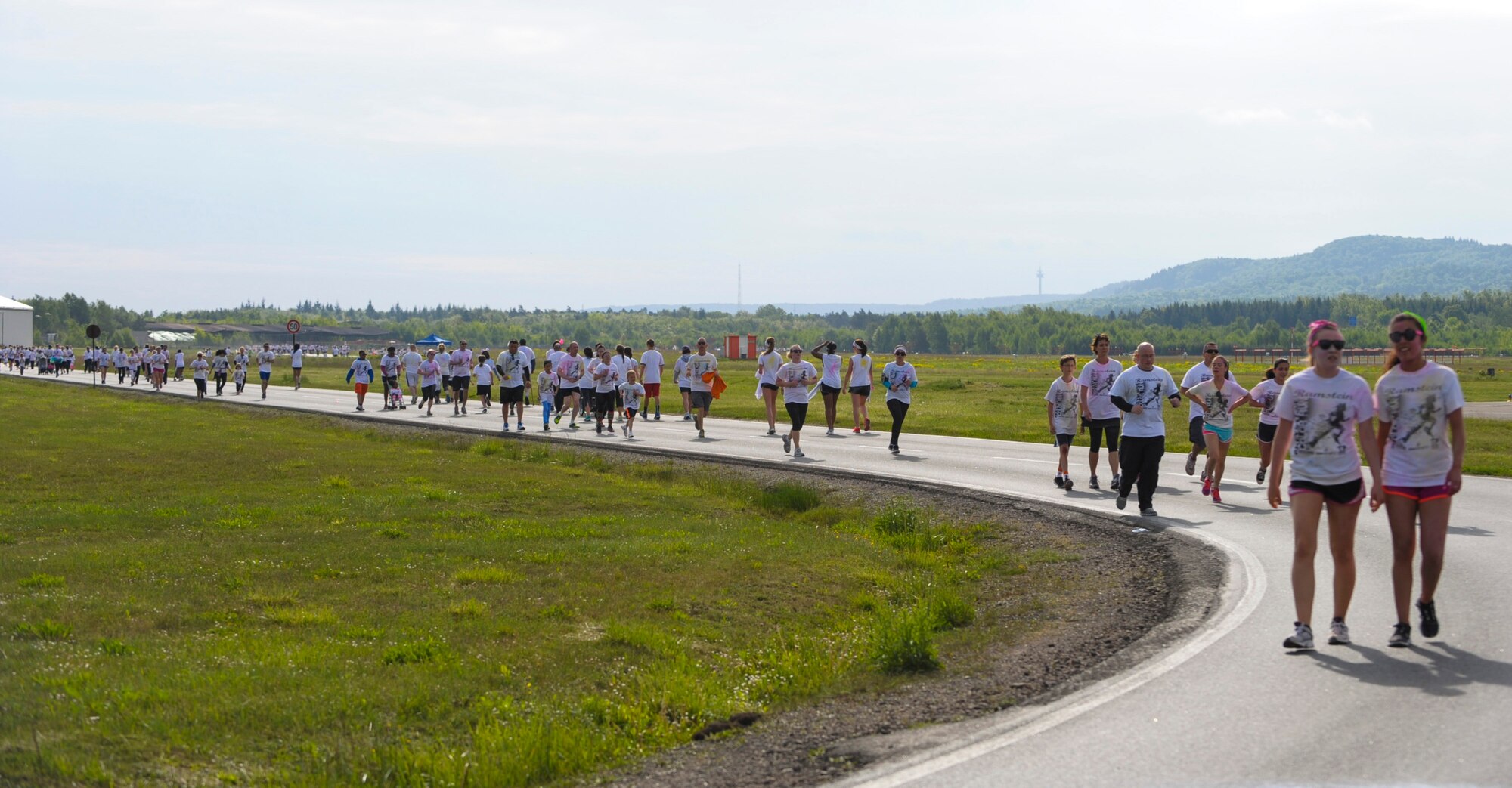 Members of Team Ramstein run during the Keystone Color Run on Ramstein Air Base, Germany, May 10, 2014. More than 800 participants came out for the family 5K to raise awareness for teen suicide. Proceeds were donated to a program dedicated to providing support for youth and veterans experiencing risk factors for suicide. (U.S. Air Force photo/Staff Sgt. Sara Keller)