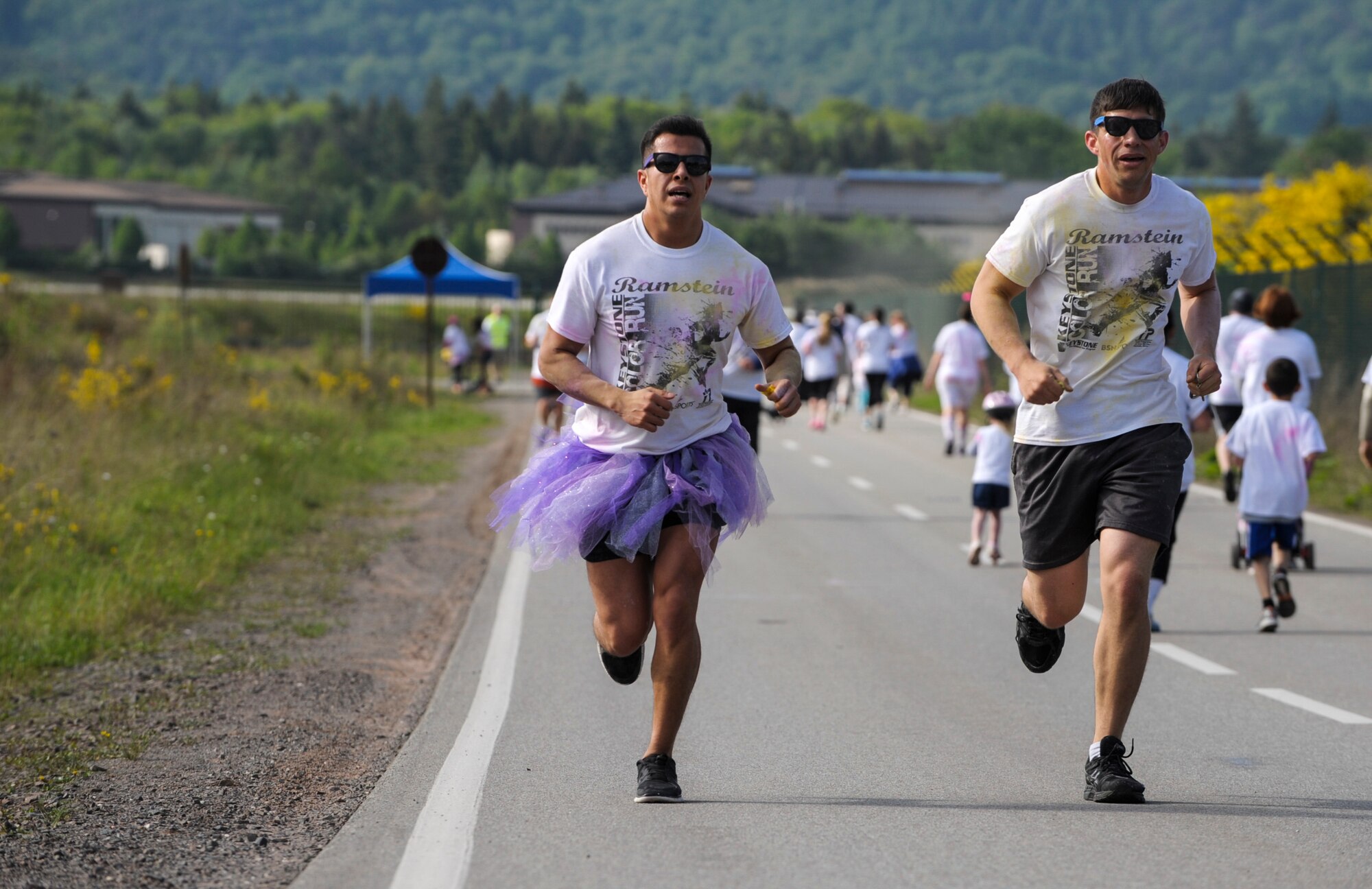 Members of Team Ramstein run during the Keystone Color Run on Ramstein Air Base, Germany, May 10, 2014. More than 800 participants came out for the family 5K to raise awareness for teen suicide. Proceeds were donated to a program dedicated to providing support for youth and veterans experiencing risk factors for suicide. (U.S. Air Force photo/Staff Sgt. Sara Keller)