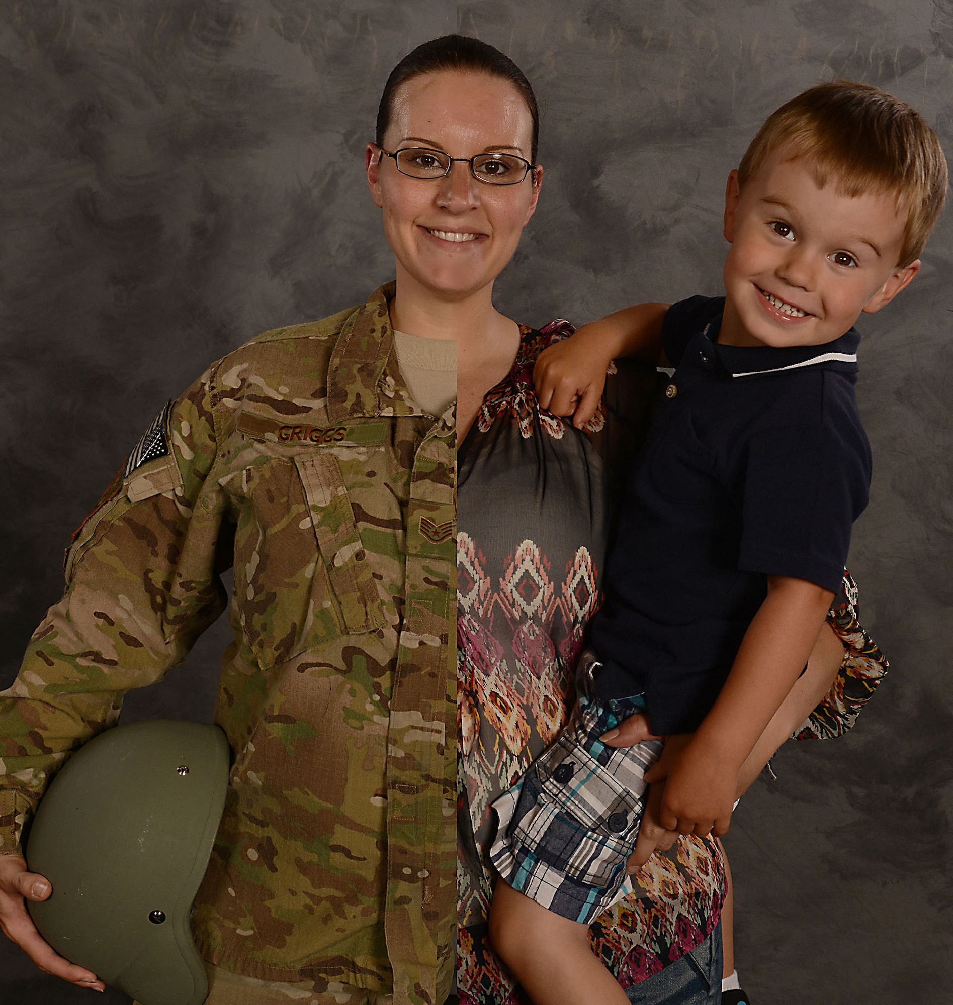 U.S. Air Force Staff Sgt. Amanda Griggs, 23d Component Maintenance Squadron aerospace propulsion craftsman, holds her son, Korbin, for a photo at Moody Air Force Base, Ga., May 8, 2014. Griggs, holding dual roles as an active-duty Airman and a mother, was selected to be highlighted as a military mom in honor of Mother’s Day 2014. (U.S. Air Force photo illustration by Senior Airman Tiffany M. Grigg/Released)