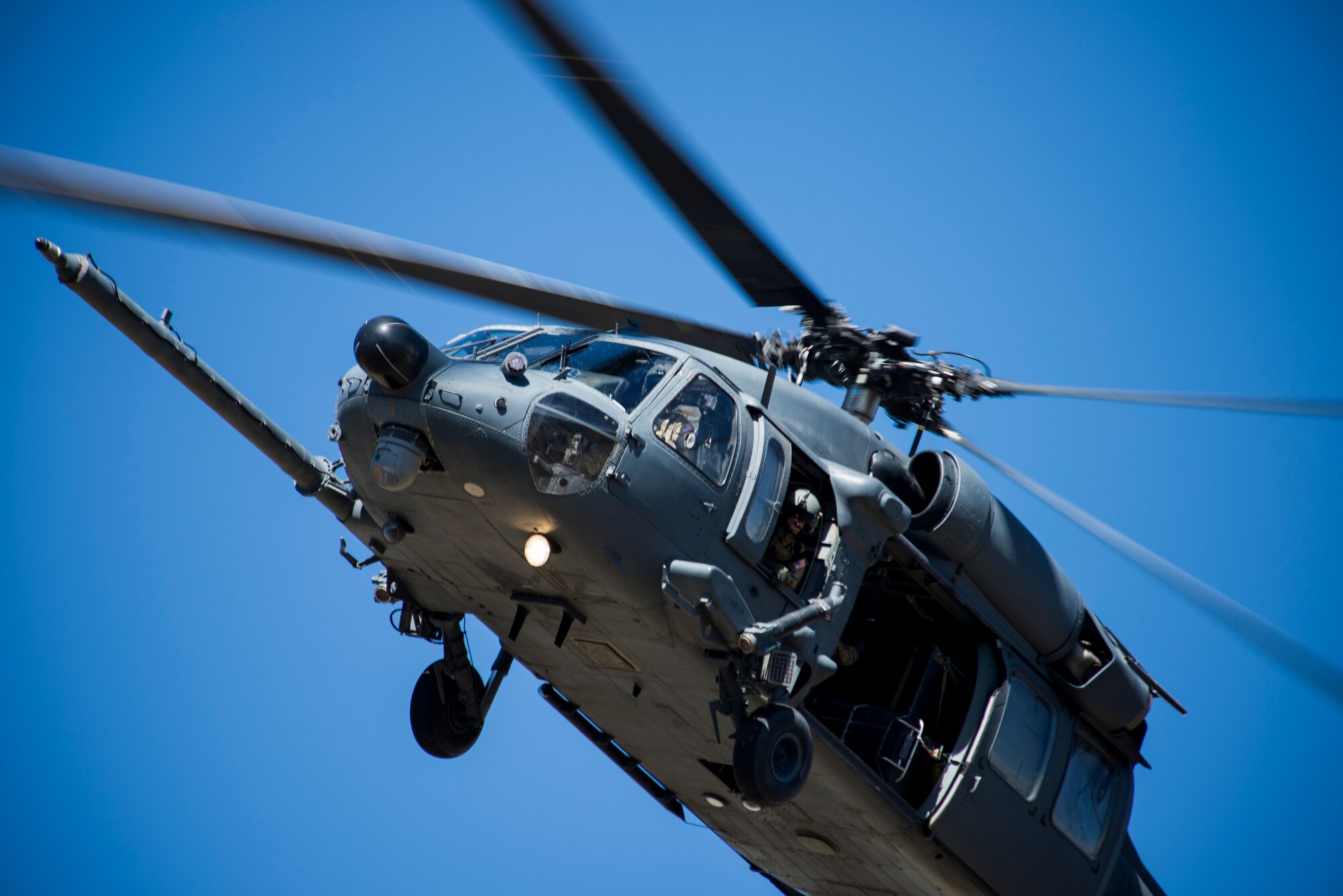 An HH-60G Pave Hawk from the 41st Rescue Squadron out of Moody Air Force Base, Ga., maneuvers through the sky during an Angel Thunder mass-casualty exercise May 9, 2014, at Camp Navajo, Ariz. The rescue unit used the HH-60 to transport injured personnel to receive further medical care. (U.S. Air Force photo by Staff Sgt. Jamal D. Sutter/Released) 
