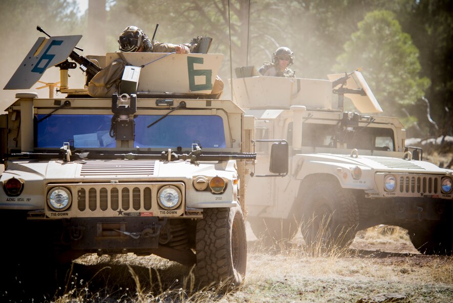 Airmen from the 58th Rescue Squadron out of Nellis Air Force Base, Nev., ride Humvees to a helicopter landing zone during an Angel Thunder mass-casualty exercise May 9, 2014, at Camp Navajo, Ariz. Angel Thunder is the largest and most realistic joint service, multinational, interagency combat search and rescue exercise designed to provide training for personnel recovery assets. (U.S. Air Force photo by Staff Sgt. Jamal D. Sutter/Released)  
