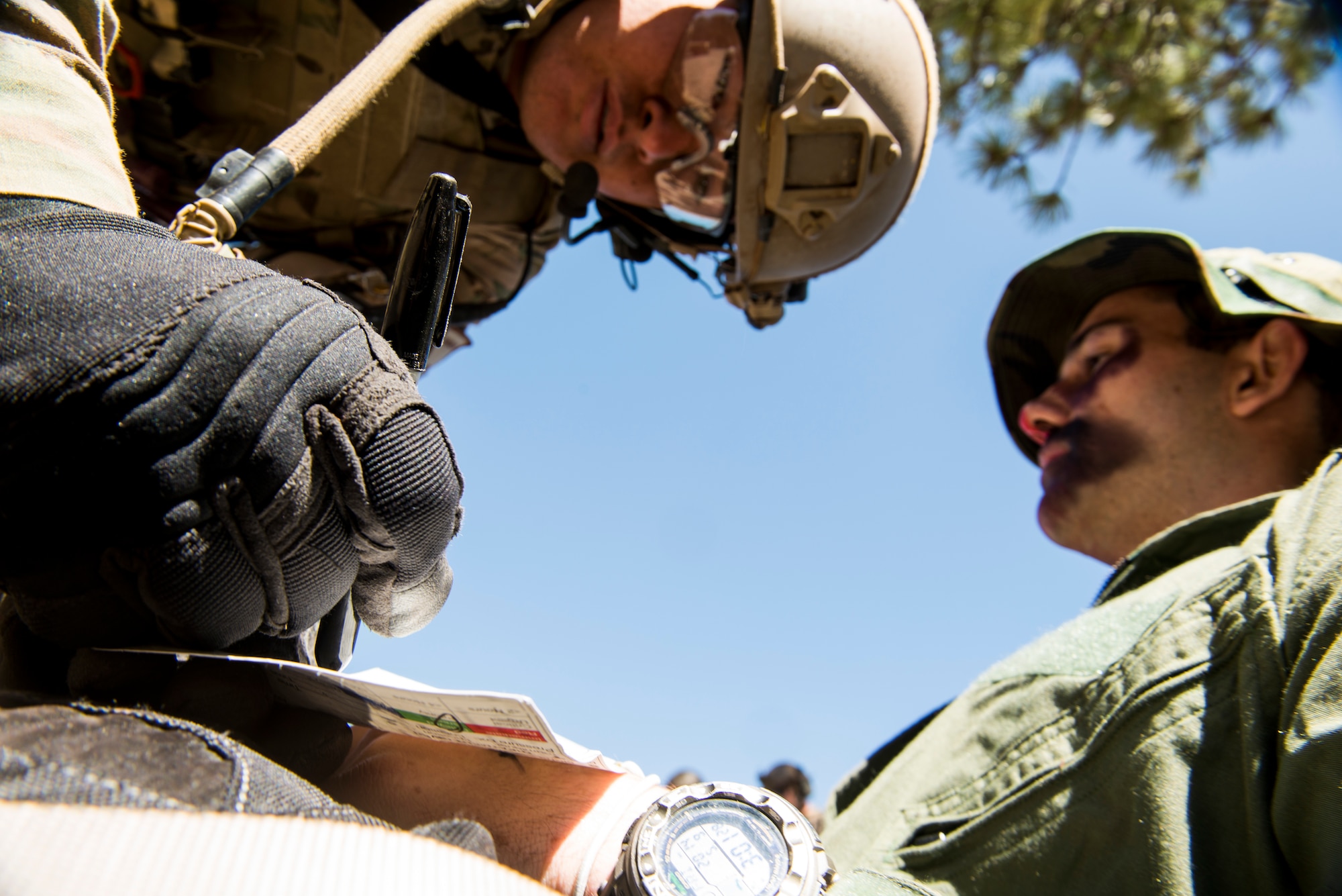 A U.S. Air Force pararescueman from the 58th Rescue Squadron out of Nellis Air Force Base, Nev., writes down the medical information and injury status of Zach Pokrant, an Air Force ROTC cadet from the University of Arizona, during an Angel Thunder mass-casualty exercise May 9, 2014, at Camp Navajo, Ariz. Pararescuemen provided immediate medical attention to the most critically-injured patients and later loaded them to HH-60G Pave Hawks for transport. (U.S. Air Force photo by Staff Sgt. Jamal D. Sutter/Released)
