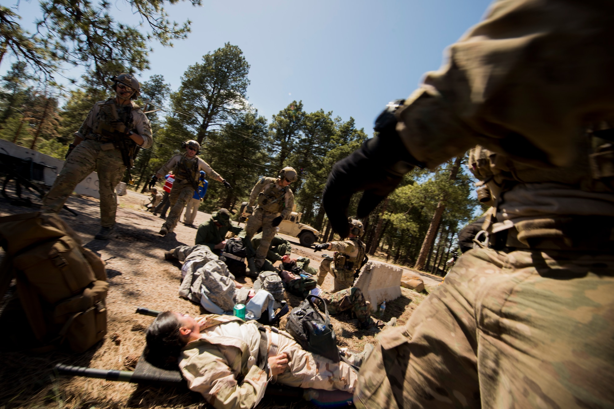 Airmen from the 58th Rescue Squadron out of Nellis Air Force Base, Nev., respond to a scenario during an Angel Thunder mass-casualty exercise May 9, 2014, at Camp Navajo, Ariz. The Airmen prioritized victims by the severity of their injuries to ensure the most critical patients received medical attention first. (U.S. Air Force photo by Staff Sgt. Jamal D. Sutter/Released) 
