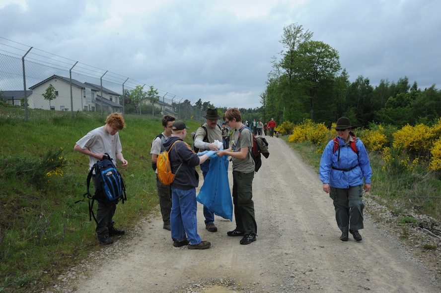 Scouts of troop 161 and 165 pick up trash during a hike May 10, 2014, near Spangdahlem Air Base, Germany.  Other than cleaning the trails, scouts trained in identifying firewood and suitable shelters.  (U.S. Air Force photo by Airman 1st Class Dylan Nuckolls/Released)