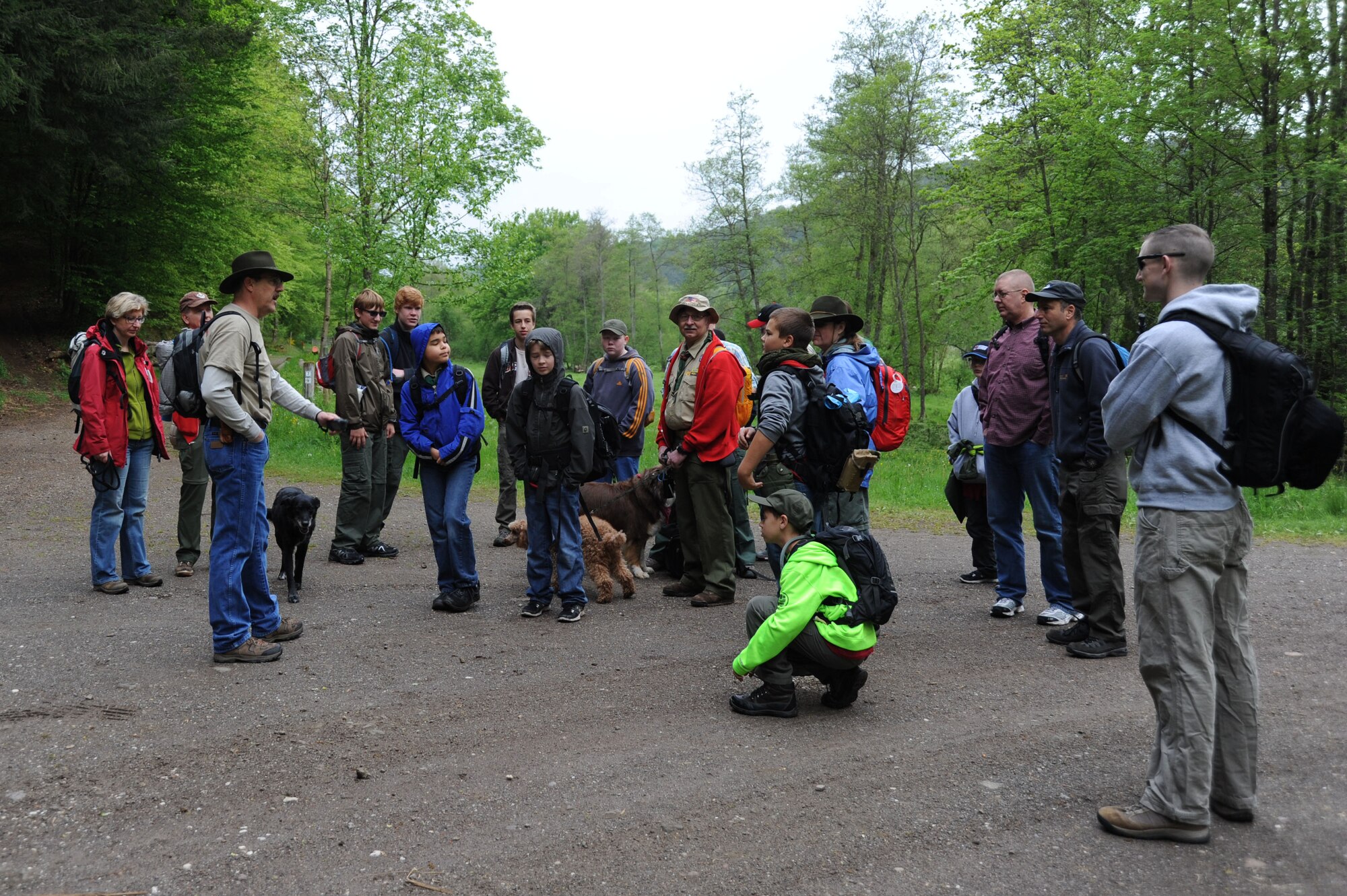 Jene Wilton, 606th Air Control Squadron Air Force engineering technical services and Boy Scouts Troop 161 assistant scout master, talks to a group of scouts and parents of troop 161 and 165 before a hike May 10, 2014, near Spangdahlem Air Base, Germany. The scouts cleaned more than 10 miles of trails for a community service project, and to raise awareness of scouting in the Eifel.  (U.S. Air Force photo by Airman 1st Class Dylan Nuckolls/Released)