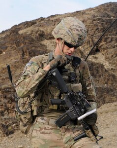 Spc. Joshua Provo, 4th Brigade Combat Team, 10th Mountain Division (Light Infantry), sends up coordinates to his higher command during a 2013 dismounted patrol in Afghanistan. A new app known as the On Demand Information Network, or ODIN, enables rapid, over-the-air mission planning for software-defined tactical radios. Built using the Mounted Android Computing Environment, ODIN could help reduce the burdensome process of Unit Task Reorganization, which is required when network adjustments are needed due to changes in mission. (U.S. Army photo by Sgt. Eric Provost)