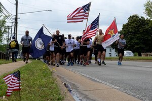 More than 70 U.S. Army Soldiers from the 359th Inland Cargo Transfer Company, 10th Transportation Battalion, 7th Transportation Brigade (Expeditionary), run with Hampton Roadscommunity members during the Second Annual Run for the Fallen event in Hampton, Va., May 1, 2014. The 236-mile run began at Fort Story, Va., and ended at Arlington National Cemetery in Arlington, Va. (U.S. Air Force photo by Senior Airman Teresa J.C. Aber/Released)