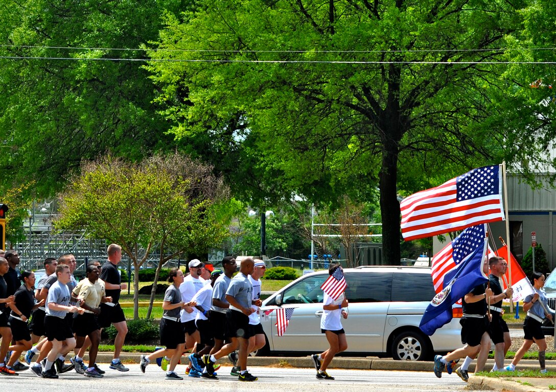 U.S. Army Soldiers from the 359th Inland Cargo Transfer Company, 10th Transportation Battalion, 7th Trans. Brigade (Expeditionary), joined Hampton Roads community members on a three-mile stretch during the second annual “Run for the Fallen. Community members ran 236 miles over four days, stopping every mile at a “hero marker” to honor a fallen Service member. (U.S. Army photo by Sergeant Stefanie Warner/Released)