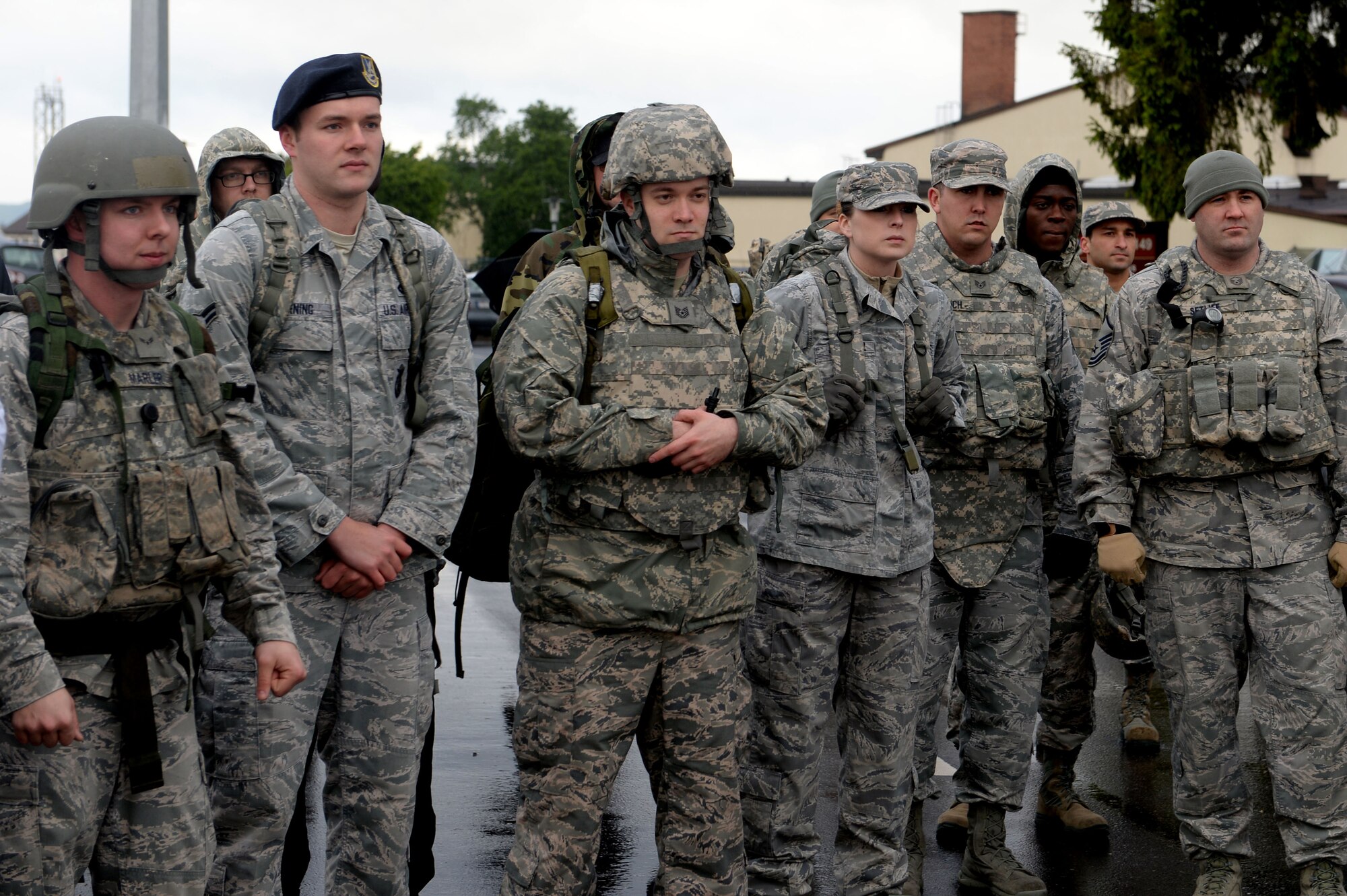 Members of the Spangdahlem community listen to the event coordinator explain the route before the Security Forces Memorial Ruck March on Spangdahlem Air Base, Germany, May 12, 2014. This event kicked off a week-long celebration of National Police Week, a U.S. nationally-recognized observance that honors fallen police officers. (U.S. Air Force photo by Senior Airman Alexis Siekert)