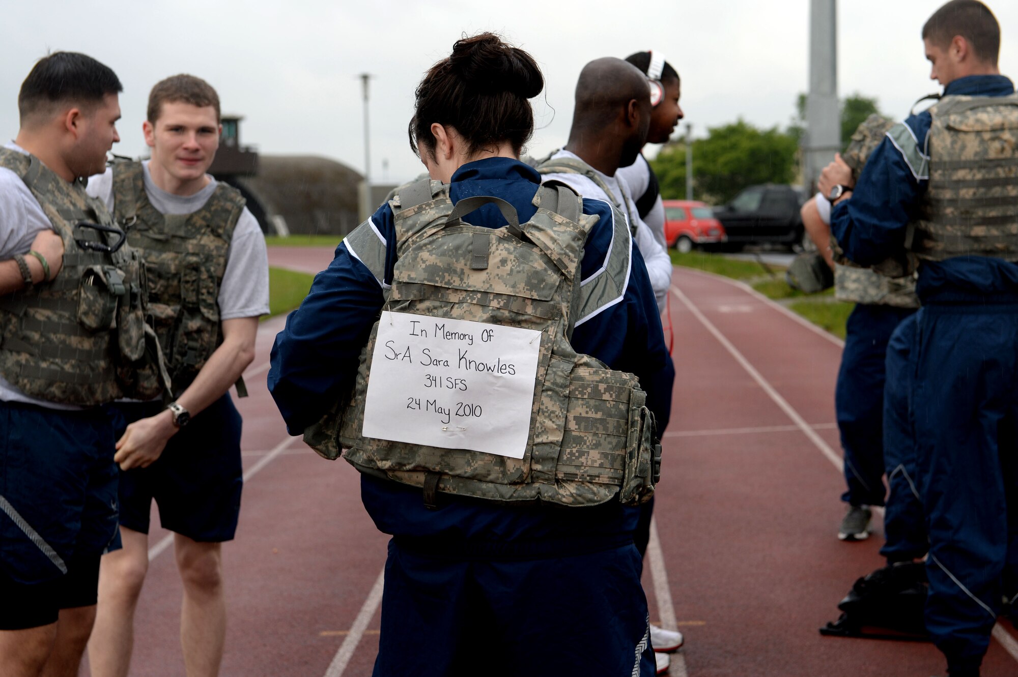 U.S. Air Force Staff Sgt. Elizabeth Puls, 52nd Security Forces Squadron patrolman from Cedaredge, Co., displays the name of a fallen defender, Senior Airman Sara Knowles, on her bullet-proof vest before the 10-kilometer Security Forces Memorial Ruck March at Spangdahlem Air Base, Germany, May 12, 2014. The march was held in remembrance of all fallen security forces and police officers as part of National Police Week. (U.S. Air Force photo by Senior Airman Alexis Siekert)