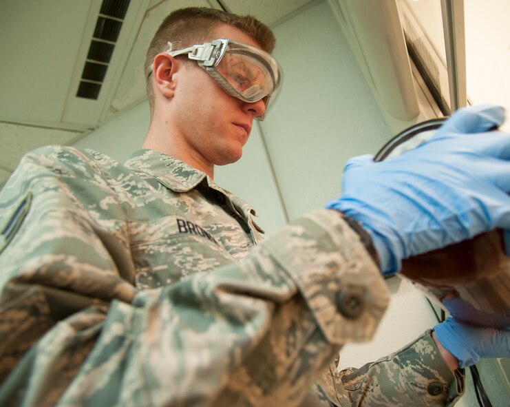 Airman 1st Class Jacob Brown, 5th Logistics Readiness Squadron fuels laboratory technician, prepares a sample of fuel to be tested for contamination at Minot Air Force Base, N.D., April 30, 2014. The laboratory inspects and filters out foreign objects from fuel on a daily basis which is vital to successful missions. (U.S. Air Force photo/Senior Airman Andrew Crawford)
