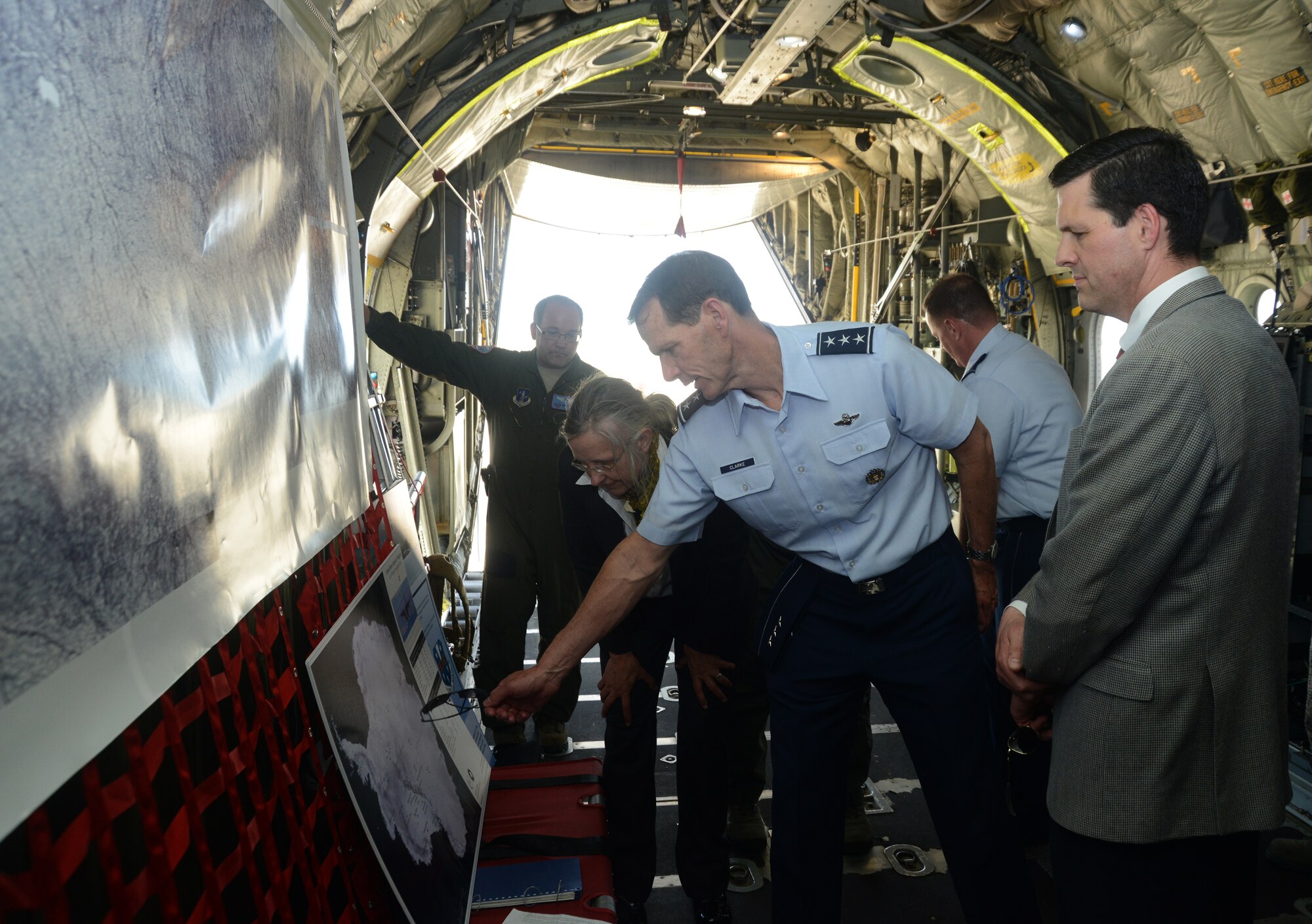 Lt. Gen. Stanley E. Clarke III, director of the Air National Guard, discusses the U.S. Antarctic Program's research program with scientists from Columbia University while touring a New York Air National Guard LC-130H Hercules aircraft at Joint Base Andrews, Md., May 8, 2014.