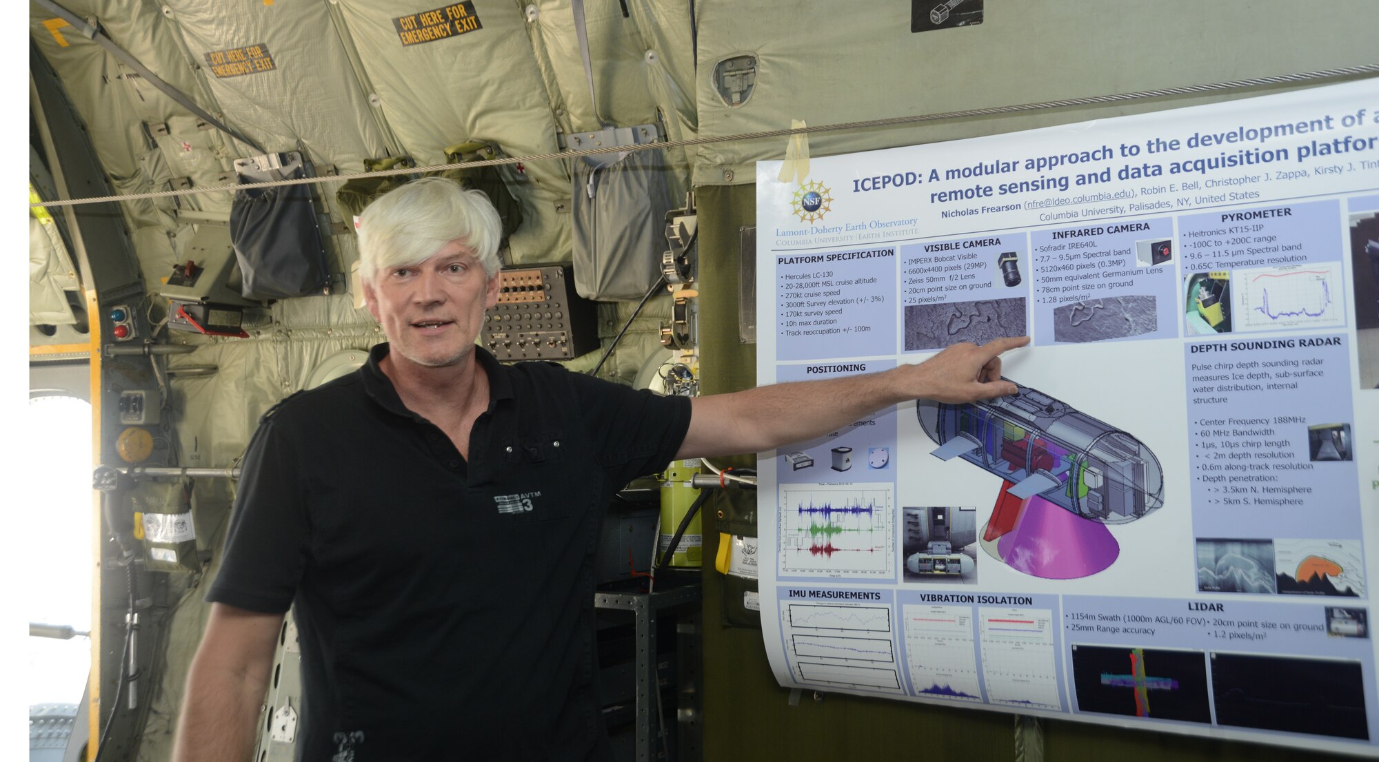 Nick Frearson, a scientist with Columbia University, gives visitors to a New York Air National Guard's ski-equipped LC-130 Hercules aircraft an overview of the National Science Foundation's Icepod at Joint Base Andrews, Md., May 8, 2014. The pod will allow the Guard to collect research data while it conducts supply and transportation flights throughout Antarctica. (U.S. Air National Guard photo by Senior Airman John Hillier/Released)