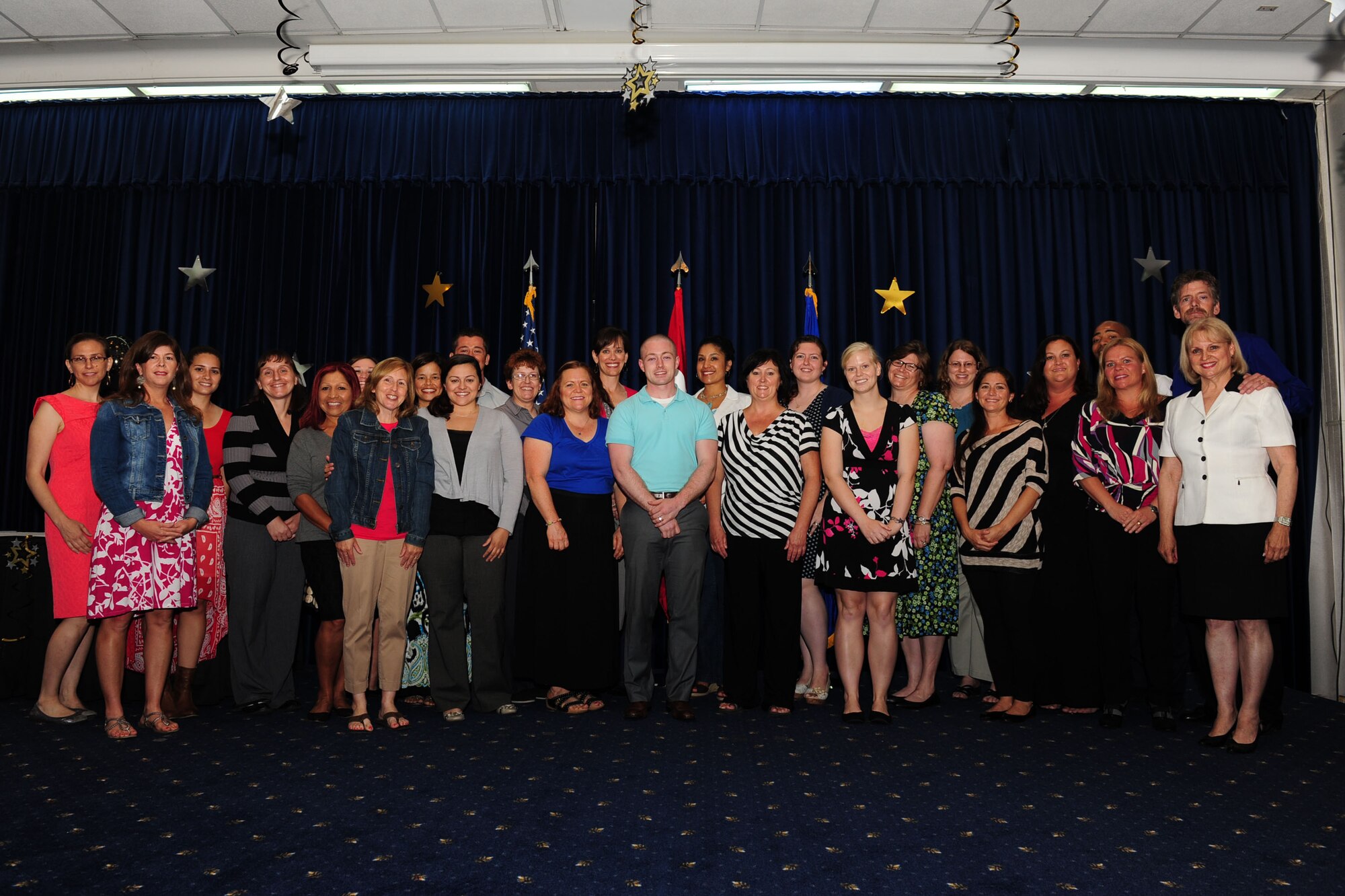 Volunteers who contributed hours to the Incirlik Air Base community are recognized on stage at the Volunteer Appreciation Ceremony May 8, 2014, Incirlik Air Base, Turkey. During the past year, more than164 Team Incirlik members volunteered approximately 21,000 hours to base agencies. (U.S. Air Force photo by Senior Airman Nicole Sikorski/Released) 