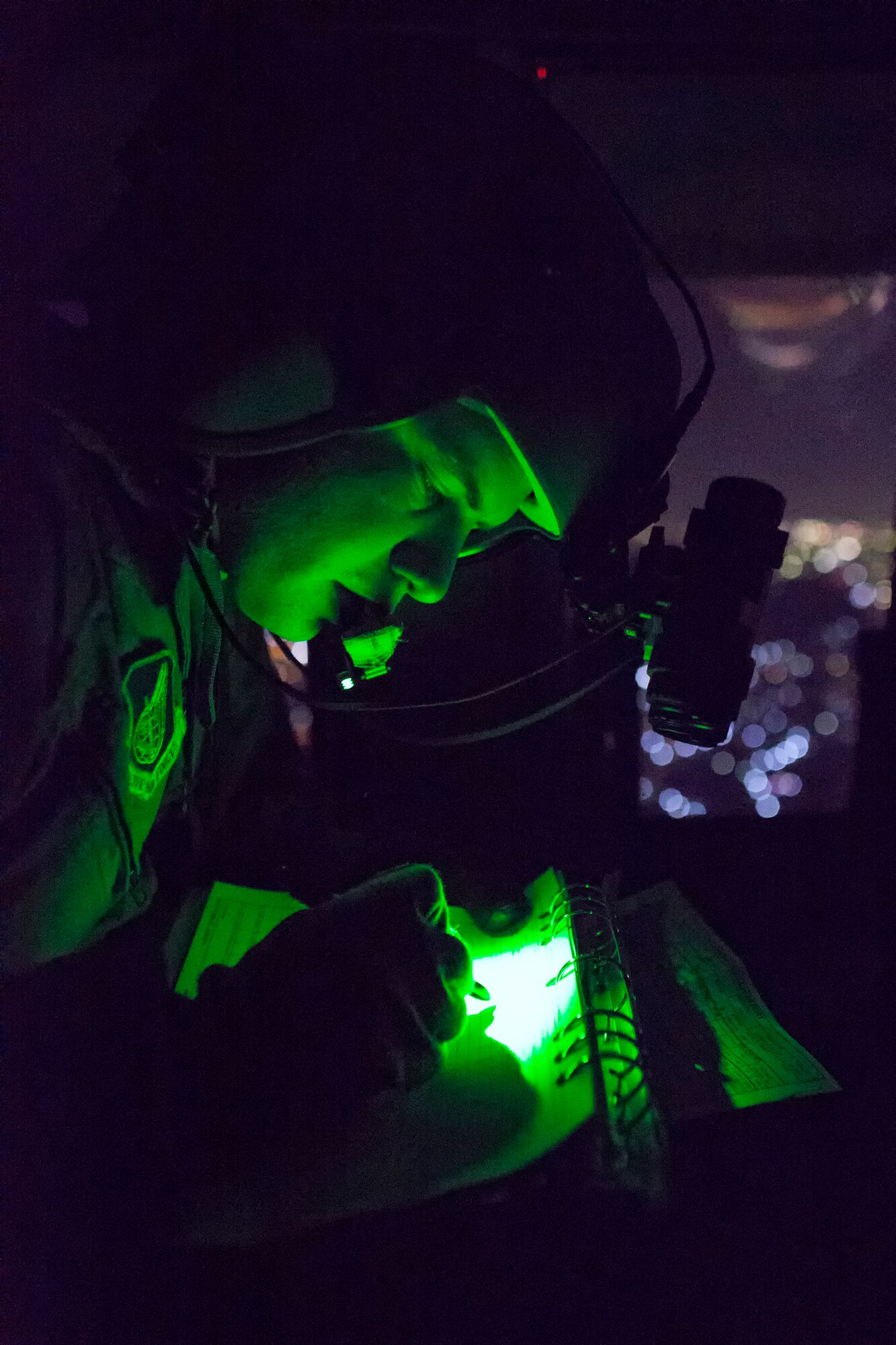 Staff Sgt. Christopher Rector, 459th Airlift Squadron flight engineer, prepares a flight record before landing at Yokota Air Base, Japan, May 7, 2014. Airmen from the 459 AS regularly practice their airlift capabilities in order to respond to regional contingencies. (U.S. Air Force photo by Osakabe Yasuo/Released)