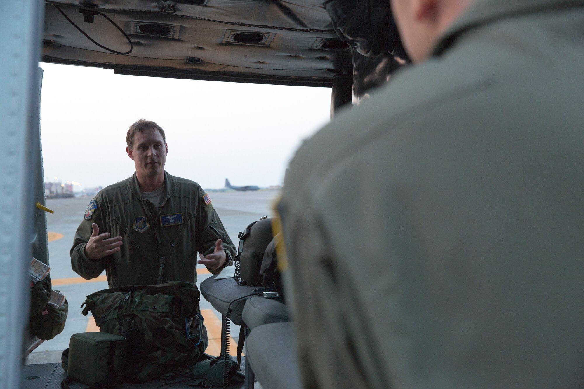 (Left to right) Tech. Sgt. Christopher Baker and Staff Sgt. Christopher Rector, flight engineers from the 459th Airlift Squadron, have a discussion prior to their pre-flight inspection on a UH-1N Huey helicopter at Yokota Air Base, Japan, May 7, 2014. Airmen from the 459 AS regularly practice their airlift capabilities in order to respond to regional contingencies. (U.S. Air Force photo by Osakabe Yasuo/Released)
