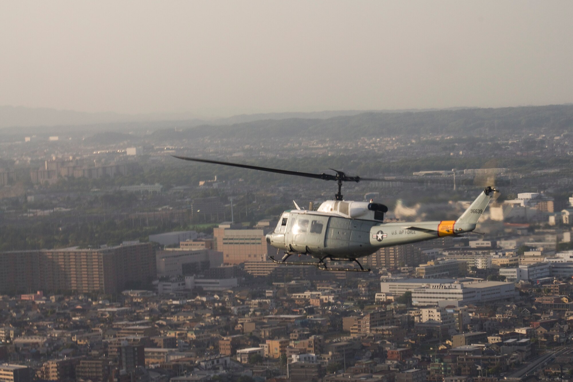 Members from the 459th Airlift Squadron perform aerial maneuvers in a UH-1N Huey at Yokota Air Base, Japan, May 8, 2014. The pilots took part in formation flying and emergency procedure exercises. (U.S. Air Force photo by Airman 1st Class David Danford/Released)