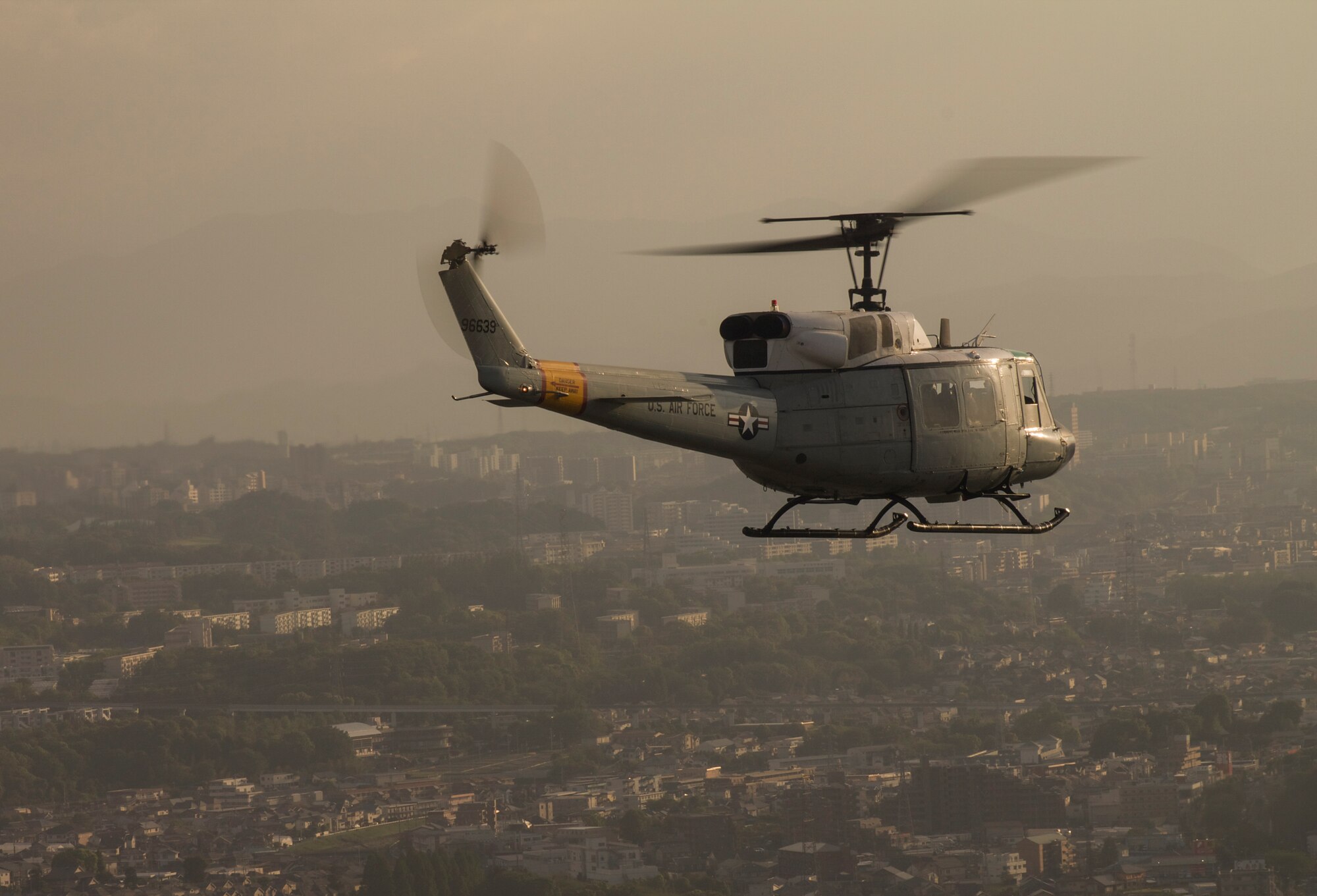 Members from the 459th Airlift Squadron fly UH-1N Huey helicopters over Yokota Air Base, Japan, May 8, 2014. The Huey has been used by the U.S. military since 1970 during the war in Vietnam. (U.S. Air Force photo by Airman 1st Class David Danford/Released)