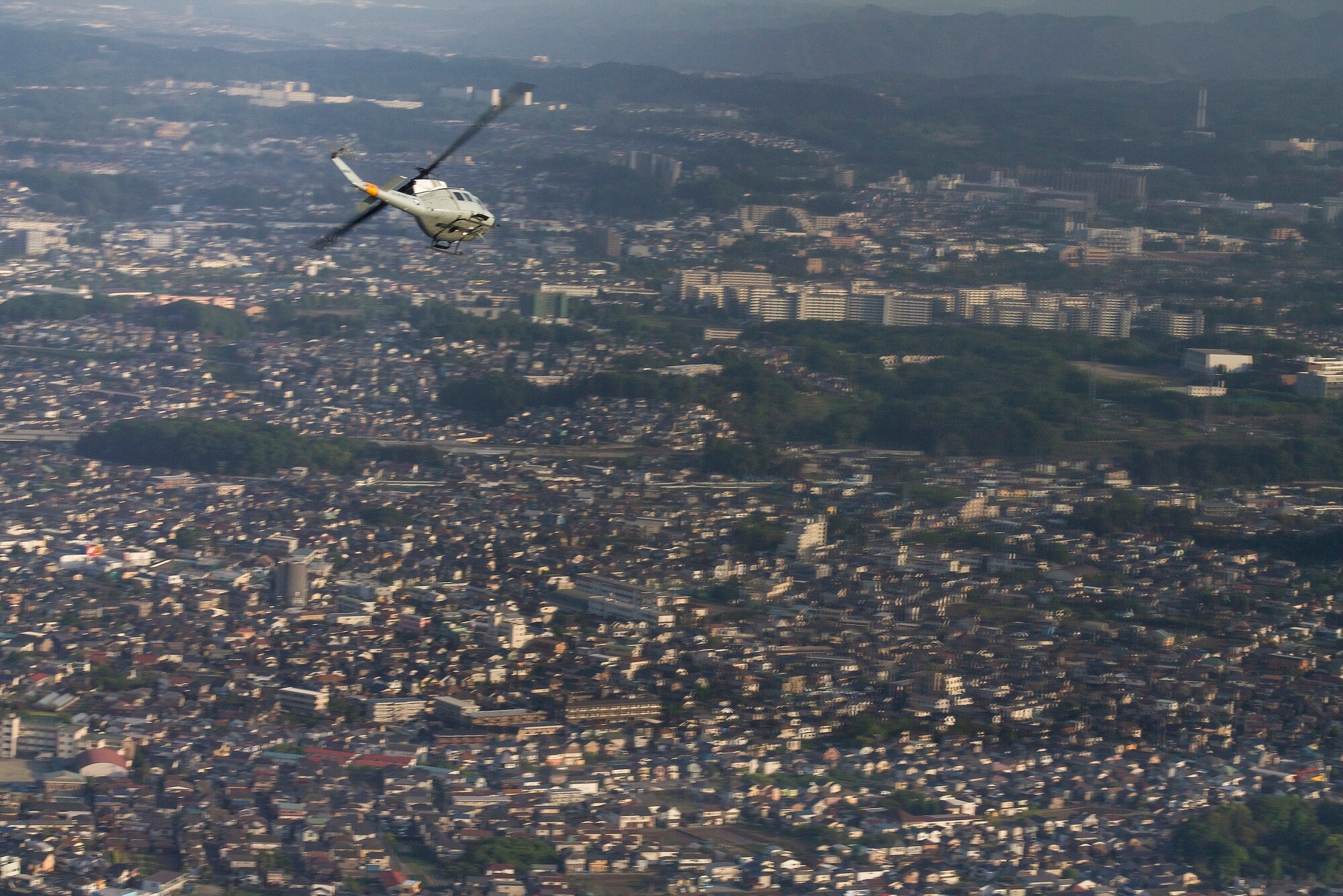 Members from the 459th Airlift Squadron conduct emergency response training at Yokota Air Base, Japan, May 8, 2014. The 459 AS performed UH-1N Huey small formation training sorties on May 8-9 to improve interoperability. (U.S. Air Force photo by Airman 1st Class David Danford/Released)