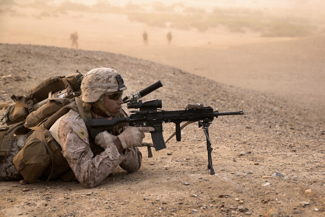 U.S. Marines Corps Lance Cpl. Javier Nunez III provides security after CH-53E Super Stallion helicopters inserted him into the area during a mission in Tagvreshk village in Afghanistan's Helmand province, May 1, 2014. Nunez, an automatic rifleman, is assigned to Bravo Company, 1st Battalion, 7th Marine Regiment. 