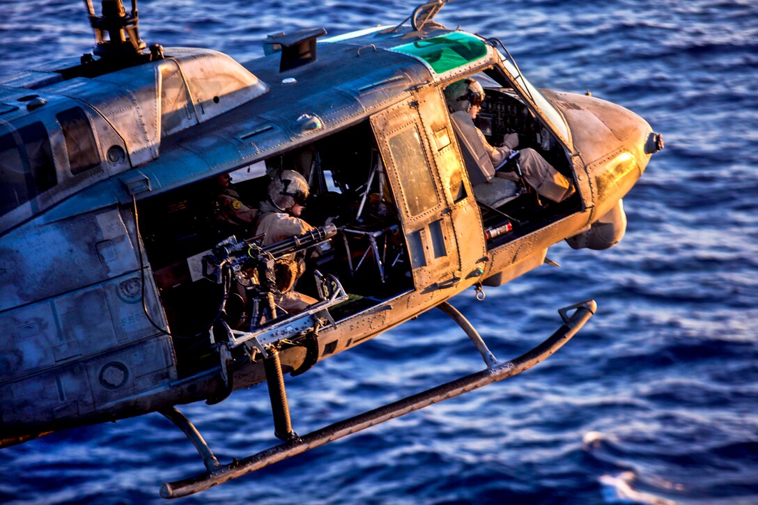 A U.S. Marine Corps Huey UH-1N lands on the flight deck of the USS Kearsarge in the 5th Fleet area of responsibility, July 13, 2013. The huey is assigned to the Marine Medium Tiltrotor Squadron 266, 26th Marine Expeditionary Unit. The Marines are deployed aboard the Kearsarge Amphibious Ready Group, which serves as a sea-based, expeditionary crisis response force capable of conducting amphibious operations across the full range of military operations. 
