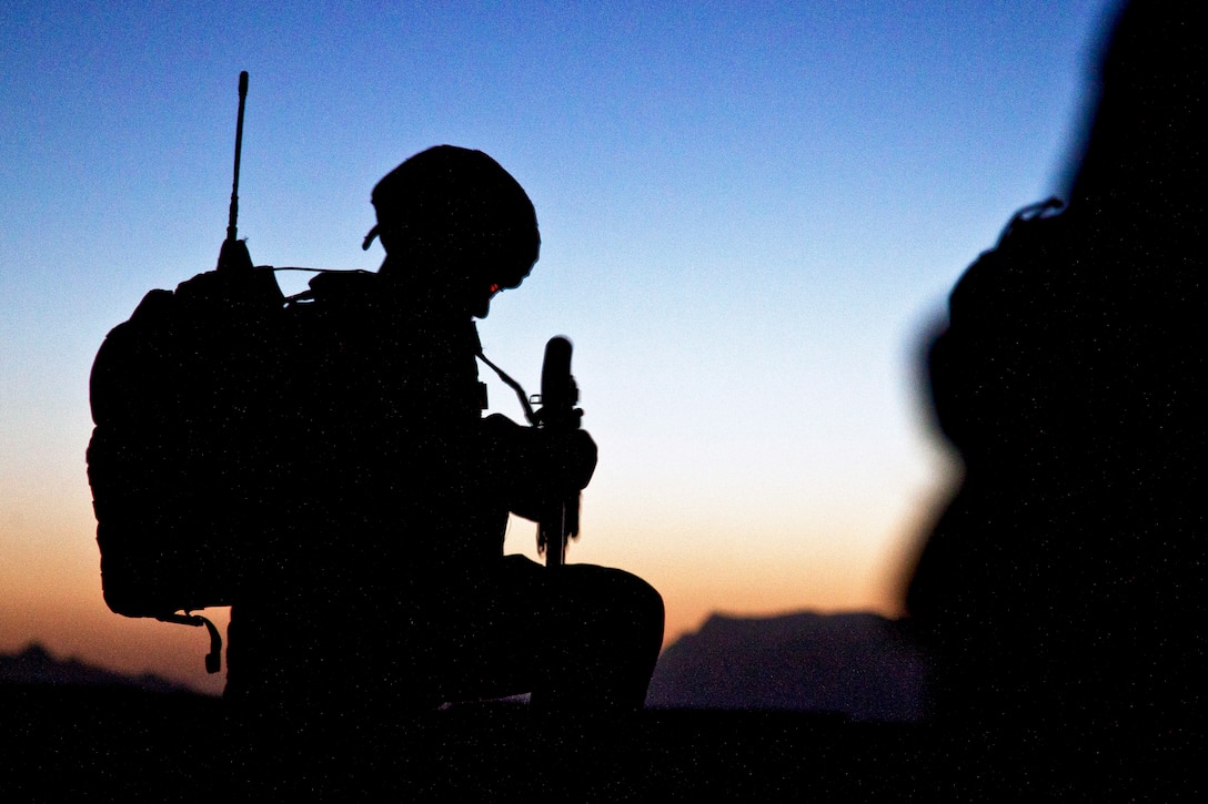 U.S. Marine Corps Cpl. Arnold H. Cabral adjusts his gear during operation Northern Lion II in Afghanistan's Helmand province, July 3, 2013. Cabral is assigned to Georgian Liaison Team 9. Georgian soldiers led the operation, conducted to deter insurgents, establish a presence and gather human intelligence in the area.  
