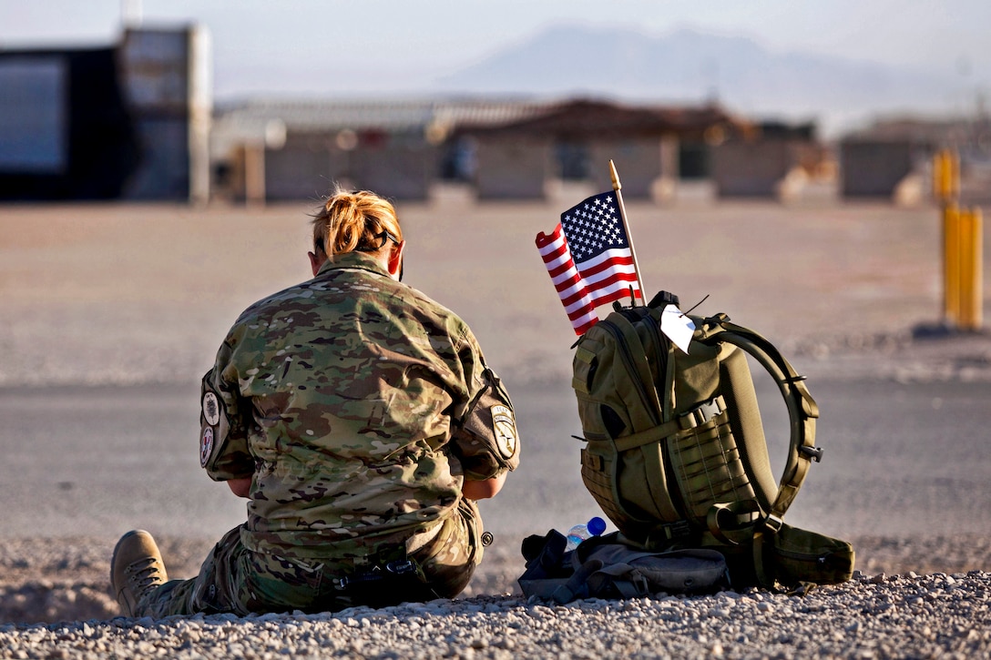 A coalition soldier prepares to provide medical support to members of the International Security Assistance Force participating in the shadow running of the 2013 Peachtree Road Race on Camp Leatherneck in Afghanistan's Helmand province, July 4, 2013. The Afghanistan event is based on the annual Peachtree Road Race in Atlanta, which launched July 4, 1970.  
