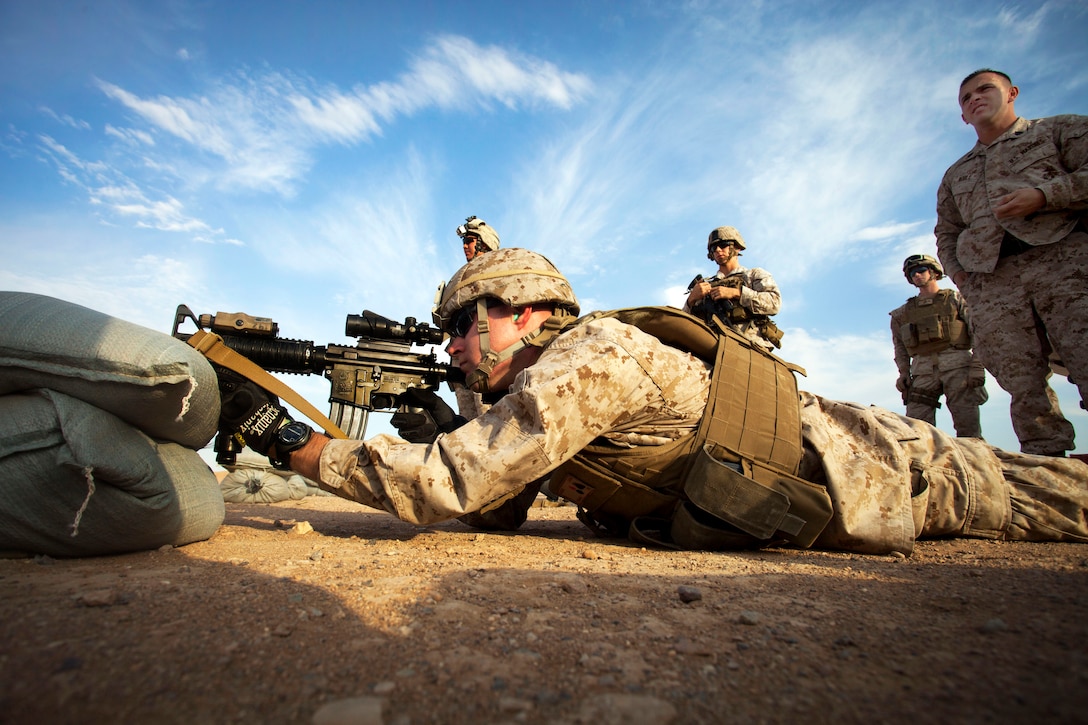 U.S. Marine Corps Cpl. Stephen Dodd engages his target during a foreign weapons and NATO ballistics live-fire shoot on Camp Leatherneck in Helmand province, Afghanistan, July 1, 2013. Dodd is assigned to Regimental Combat Team 7.  
