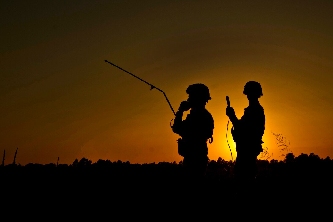 Paratroopers call for indirect fire during an airfield seizure at Sicily Drop Zone during Operation Fury Thunder, a training exercise, on Fort Bragg, N.C., June 22, 2013.  
