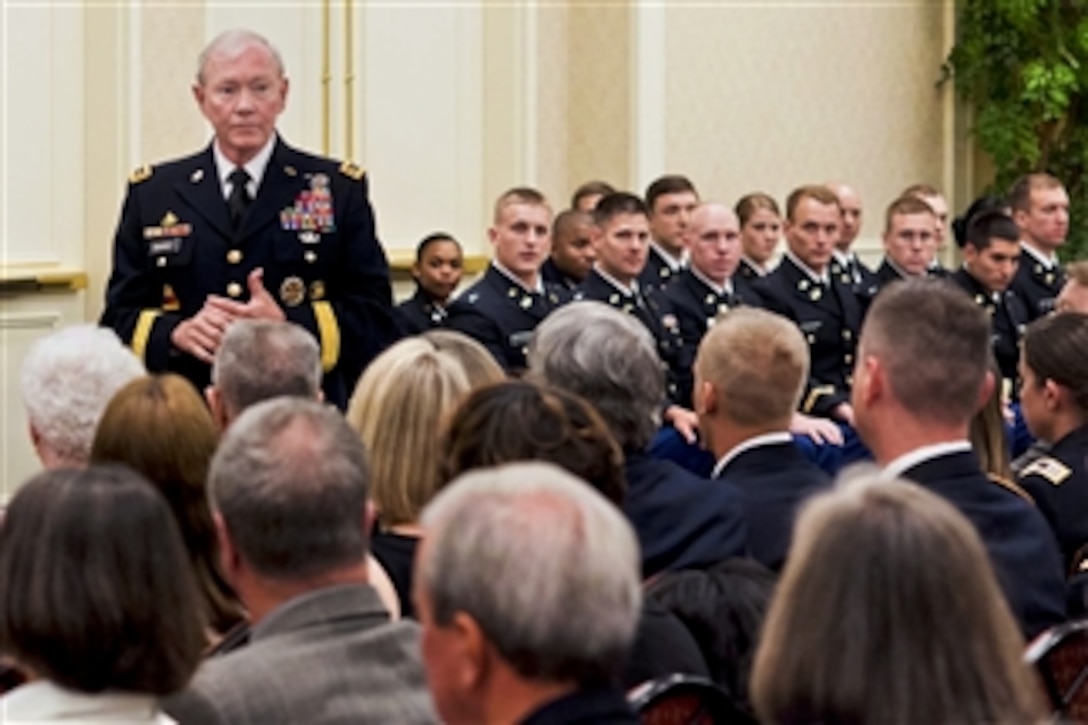 Army Gen. Martin E. Dempsey, chairman of the Joint Chiefs of Staff, talks to the audience and 20 ROTC cadets before a commissioning ceremony at Duke University in Durham, N.C., May 10, 2014. Dempsey delivered the commencement address to the university's graduates the next day.