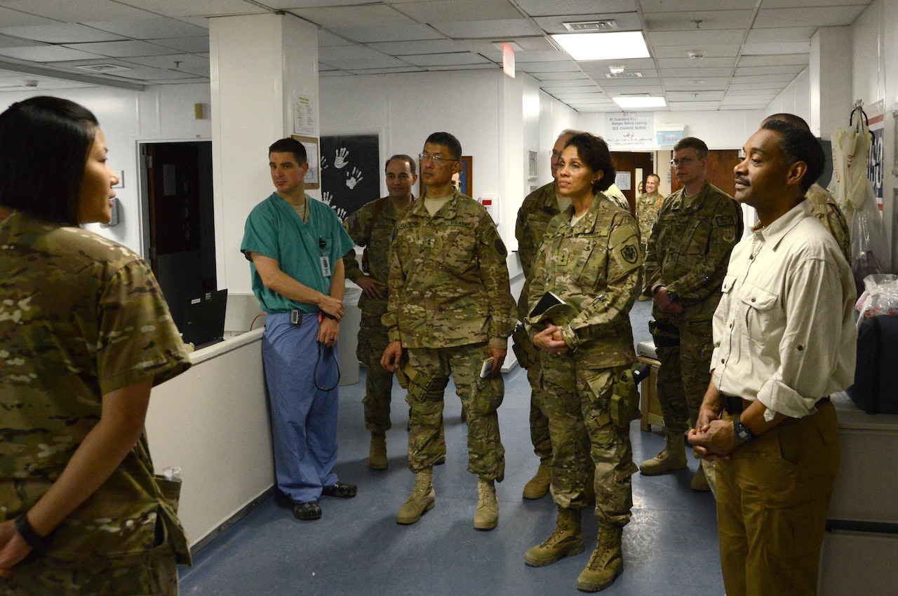 BAGRAM AIRFIELD, Afghanistan - Dr. Jonathan Woodson, Assistant Secretary of Defense for Health Affairs listens to a brief during his visit to the 455th Expeditionary Medical Group at the Craig Joint Theater Hospital, Bagram Airfield, Afghanistan May 8, 2014. Woodson is responsible for ensuring the effective execution of the Department of Defense medical mission and overseeing the development of medical policies, analyses, and recommendations to the Secretary of Defense and the Undersecretary for Personnel and Readiness, and issues guidance to DoD components on medical matters.  (U.S. Air Force photo by Master Sgt. Cohen A. Young)