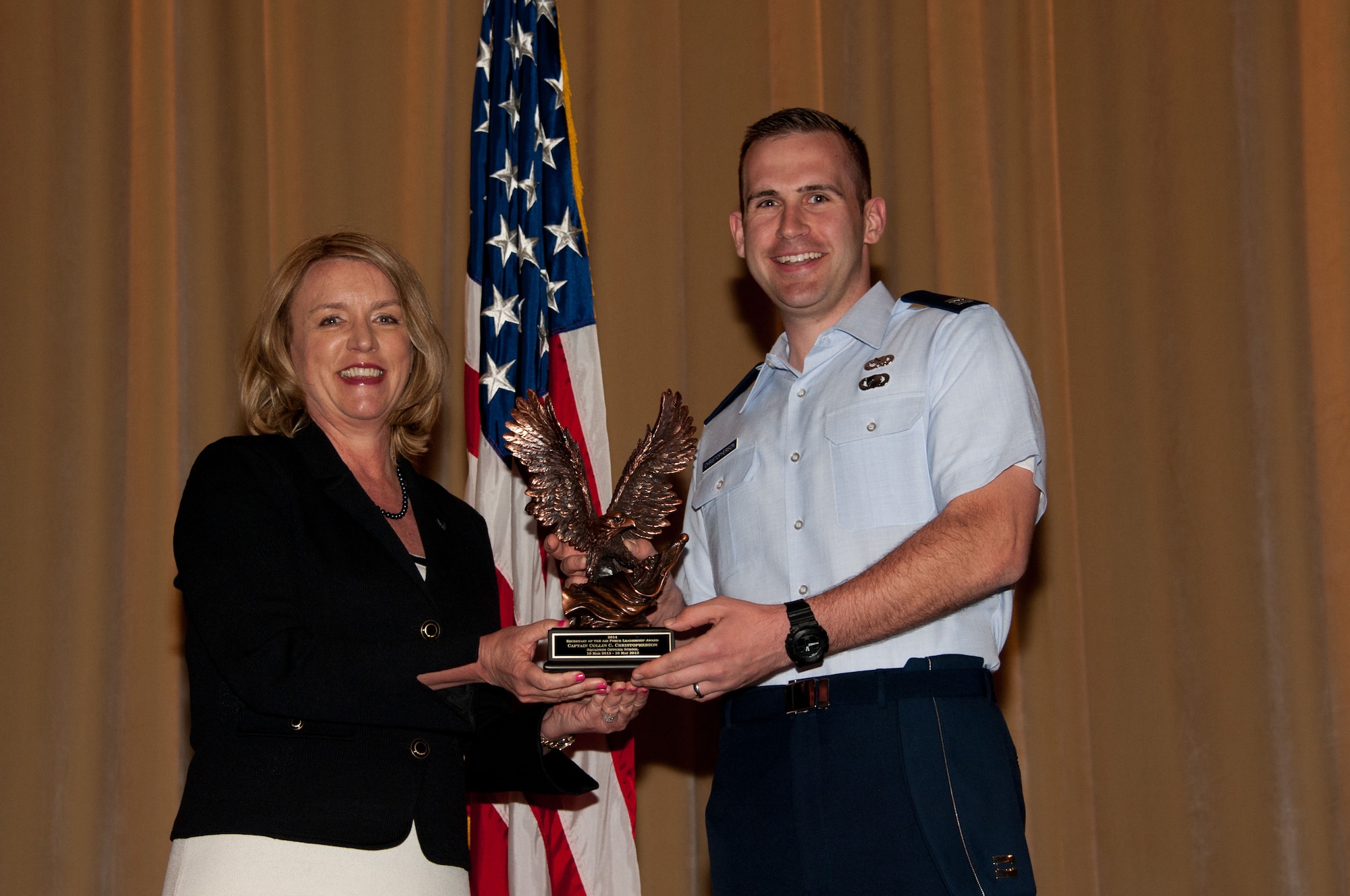 Secretary of the Air Force Deborah Lee James presents the 2014 Secretary of the Air Force leadership award to Squadron Officer School student Capt. Collin Christopherson, May 5, at Maxwell Air Force Base, Ala. The award is the Air Force's most prestigious award for leadership honoring exceptional performance in a professional military education setting. (U.S. Air Force photo/Bud Hancock)
