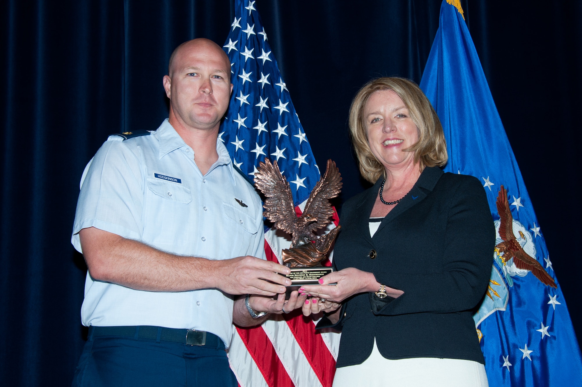 Secretary of the Air Force Deborah Lee James presents the 2014 Secretary of the Air Force leadership award to Maj. Houston Hodgkinson, Air Command and Staff College student, May 5, in Montgomery, Ala. The award is the Air Force's most prestigious award for leadership honoring exceptional performance in a professional military education setting. (Courtesy photo/Melanie Rodgers Cox)