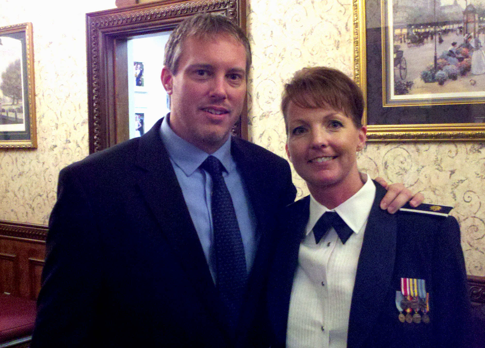 Chris Pape, founder of "Macho Spouse," and his wife Maj. Dana Pape, Air Education and Training Command, Directorate of Manpower, Personnel and Services, Resources section chief, pose for a photo during an Air Force function. Chris is lauded in the citation for bringing a male, military spouse perspective into the spotlight as the founder of "Macho Spouse," an interactive online resource and educational video library. Macho Spouse videos capture life lessons from male spouses, advice from family counselors and career tips from military spouse career experts. (Courtesy photo)