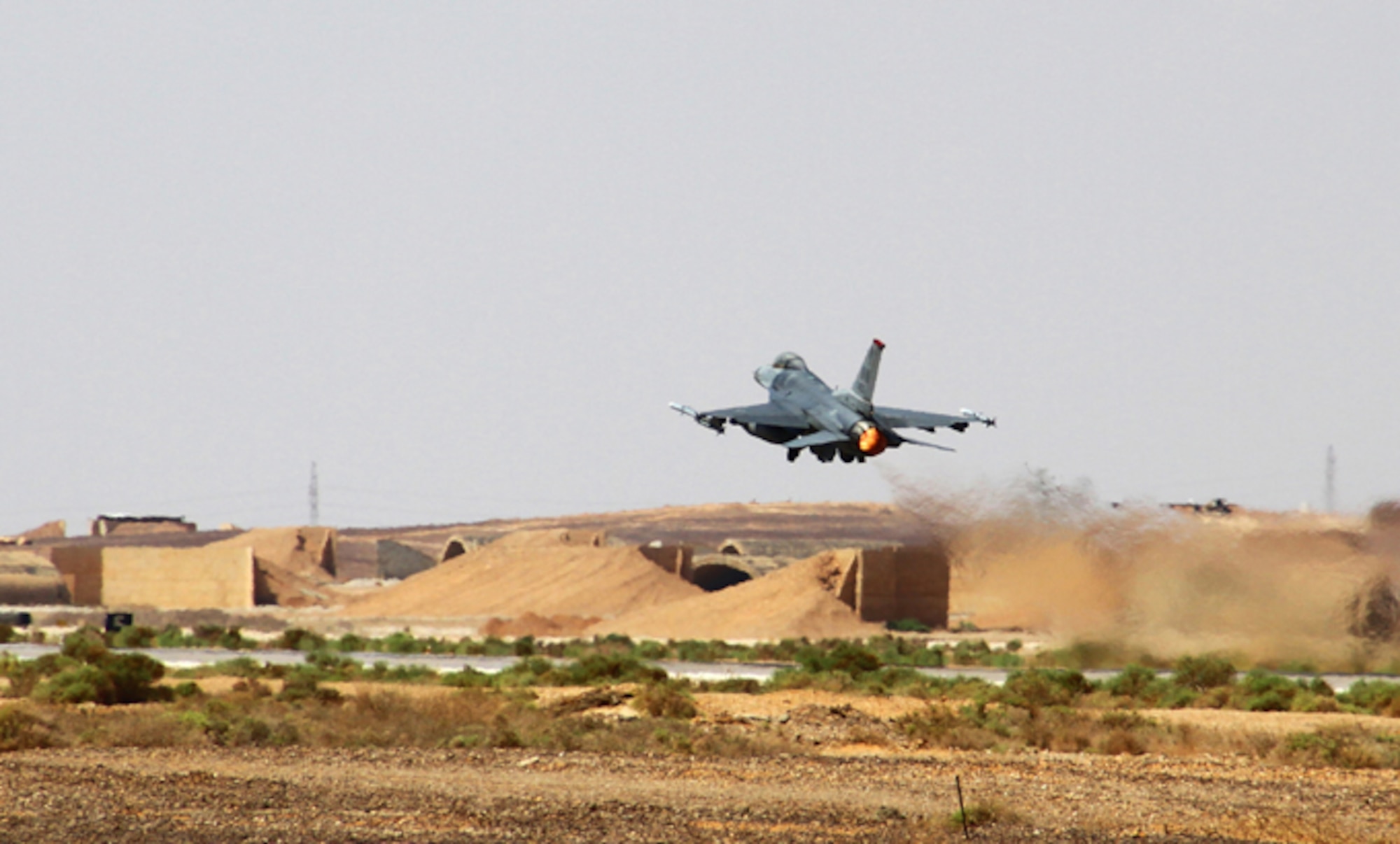 An F-16 Fighting Falcon from the 13th Fighter Squadron at Misawa Air Base, Japan, takes off during Exercise Eager Tiger May 11, 2014, at an air base in northern Jordan. This multi-national exercise allows fighter pilots to collaborate and practice their tactics and techniques. (U.S. Air Force photo/Staff Sgt. Tyler McLain)