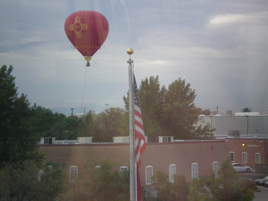 ALBUQUERQUE, N.M., -- One of the hundreds of hot air balloons from the Albuquerque Balloon Festival floats near the District Office. Photo by Douglas Bailey, Oct. 4, 2011.