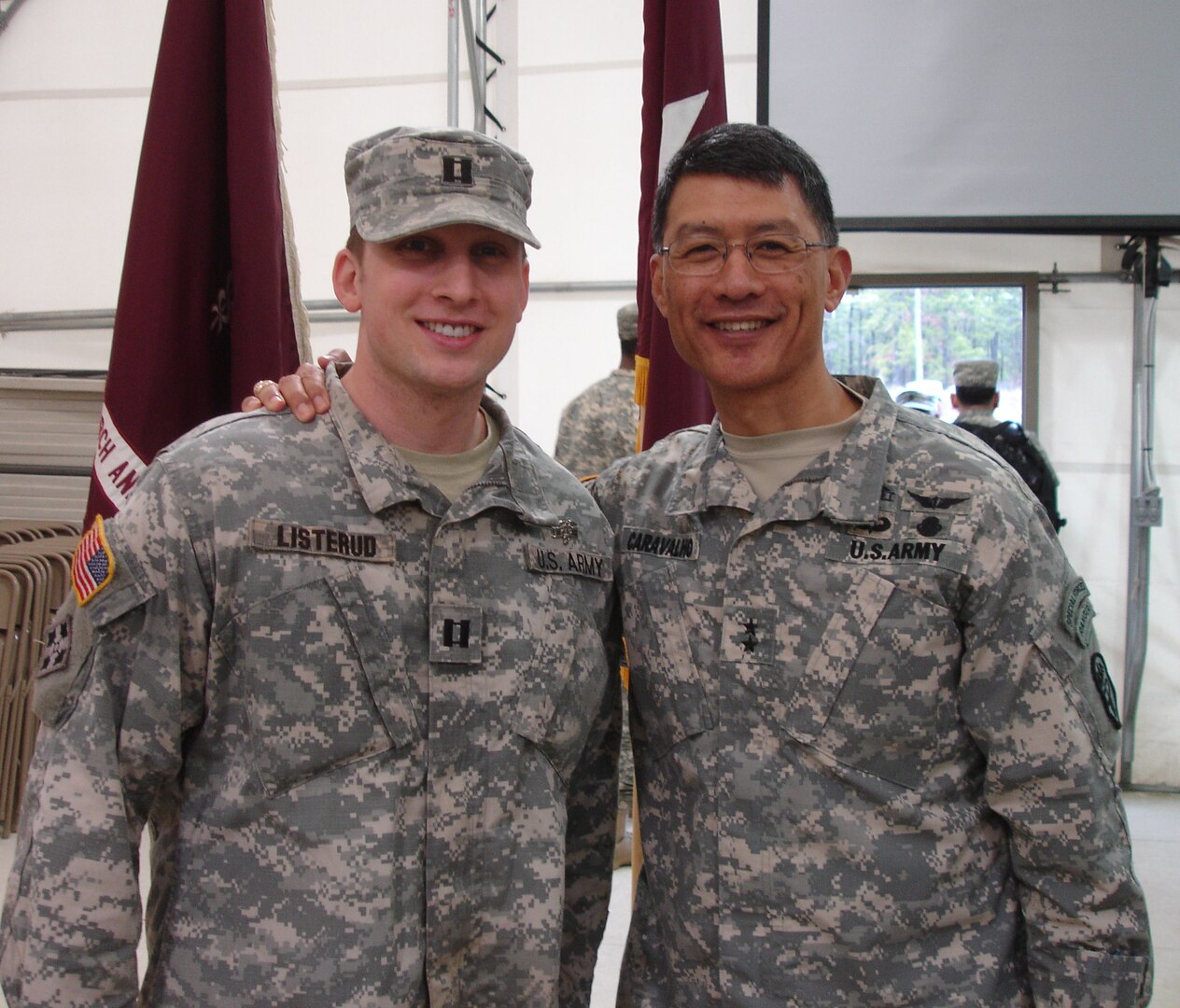 Army Capt. Bjorn Listerud stands with Maj. Gen. Joseph Caravalho, commanding general of the U.S. Army Medical Research and Materiel Command, after earning the Expert Field Medical Badge April 2. 