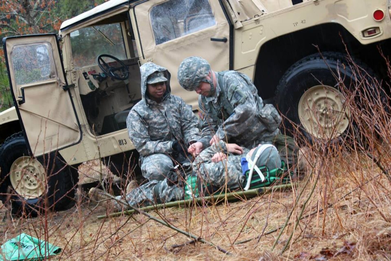 Badge candidates practice securing soldiers to a combat stretcher, known as a litter, during badge qualification. 