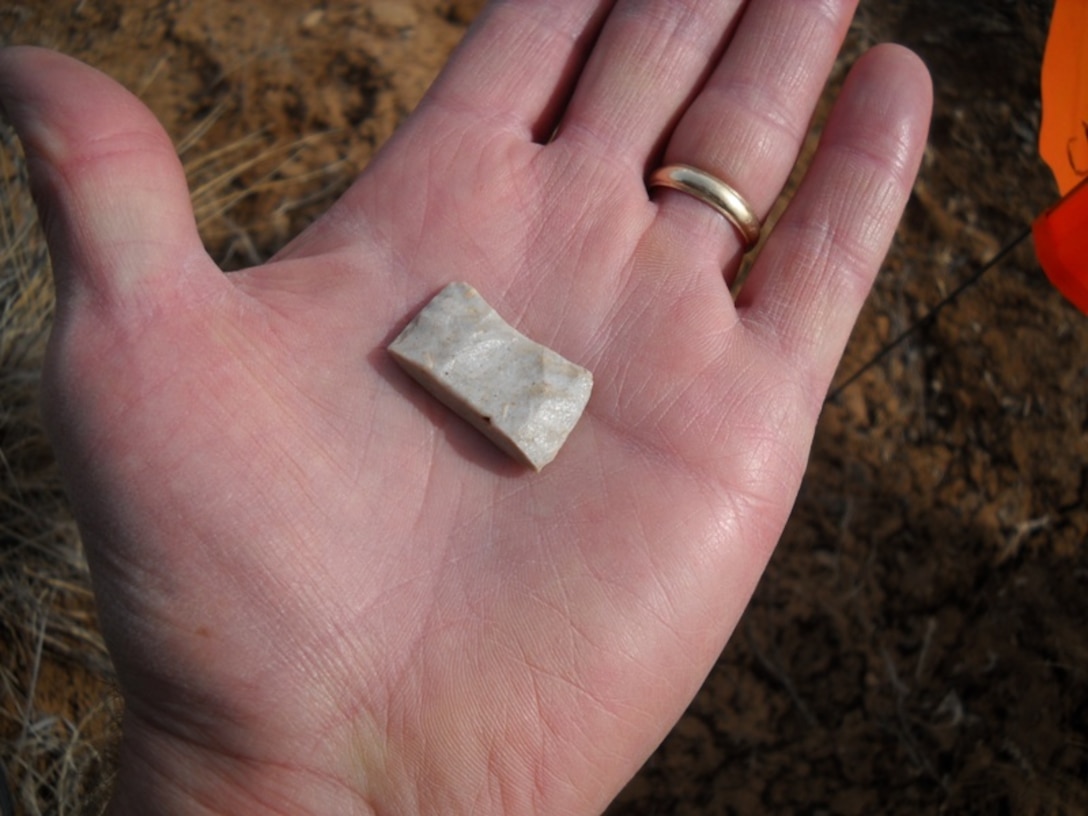 COCHITI LAKE, N.M., -- Gregory Everhart holds the base fragment of an approximately 13,000 year old Clovis Period projectile point he discovered at the District's Cochiti Lake, N.M.  Photo by Gregory D. Everhart, Jan. 27, 2010.