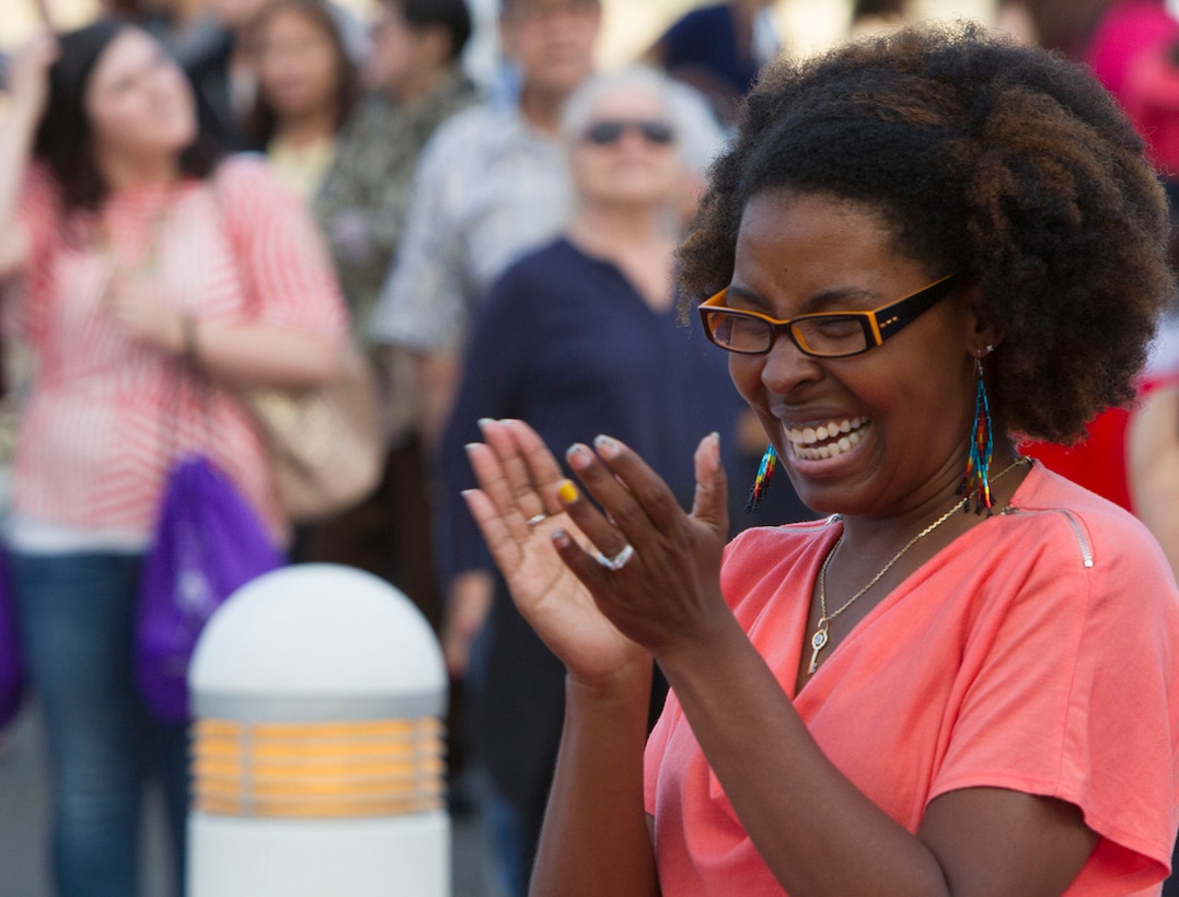 Rona Wiggins, Marine wife with Marine Medium Fighter Attack Squadron (VMFA) 314, claps following a line dance during a Military Spouse Appreciation Night at the Bob Hope Theater aboard Marine Corps Air Station Miramar, Calif., May 9. The celebration highlighted the homefront heroes of the air station and 3rd Marine Aircraft Wing. The event, hosted by Marine Corps Community Services, featured pampering and entertainment provided by local companies, followed by a stand-up comedy performance by the author of “Confessions of a Marine Wife,” Mollie Gross.