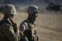 Corporal Joshua Tucker, right, a Marine musician with Headquarters Company, Headquarters Battalion, 1st Marine Division, posts security at the division entry control point during Exercise Desert Scimitar at Marine Corps Air Ground Combat Center Twentynine Palms, Calif., May 10, 2014. It is not uncommon for Marines like Tucker, a native of Carson City, Nev., to be called upon to maintain security during field training. 1st Marine Division acts as the headquarters element of I Marine Expeditionary Force during the duration of the exercise. (U.S. Marine Corps photograph by Sgt. Timothy Lenzo/RELEASED)