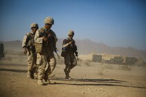 Marines with Headquarters Battalion, 1st Marine Division, participate in Exercise Desert Scimitar at Marine Corps Air Ground Combat Center Twentynine Palms, Calif., May 10, 2014. Service members with the division are operating as the headquarters element of I Marine Expeditionary Force. They will train in field conditions for more than a week, testing and refining their ability to operate in a forward environment. The tough live-fire training that accompanies the exercise allows 1st Marine Division to meet possible real-world operational demands. (U.S. Marine Corps photograph by Sgt. Timothy Lenzo/RELEASED)