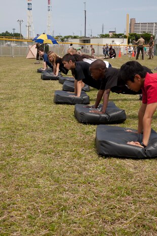 Photo by Lance Cpl. David Hersey


Yuki Ebren practices a Marine Corps Martial Arts Program technique May 2 during a Junior Warrior Day at Kinser Elementary School on Camp Kinser. The students were taught the basic warrior stance along with some simple punches and kicks by Marine volunteers. The students are with the fifth-grade classes of Kinser Elementary School. The Marine volunteers are with 3rd Maintenance Battalion, Combat Logistics Regiment 35, 3rd Marine Logistics Group, III Marine Expeditionary Force.

