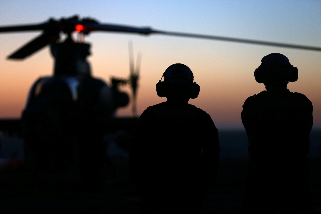 Marines with Marine Medium Tiltrotor Squadron 163 (Reinforced), 11th Marine Expeditionary Unit, stand by to assist the take-off preparation of an AH-1Z Cobra during a take-off drill on the flight deck of the USS San Diego during Composite Training Unit Exercise off the coast of San Diego, May 11, 2014. COMPTUEX is the second at-sea period during the 11th MEU's predeployment cycle, in which the MEU will conduct concurrent mission planning and execution integrated across all element of the Marine Air Ground Task Force while supporting Amphibious Squadron 5 in their evaluated training. (U.S. Marine Corps photo by Gunnery Sgt. Rome M. Lazarus/Released)