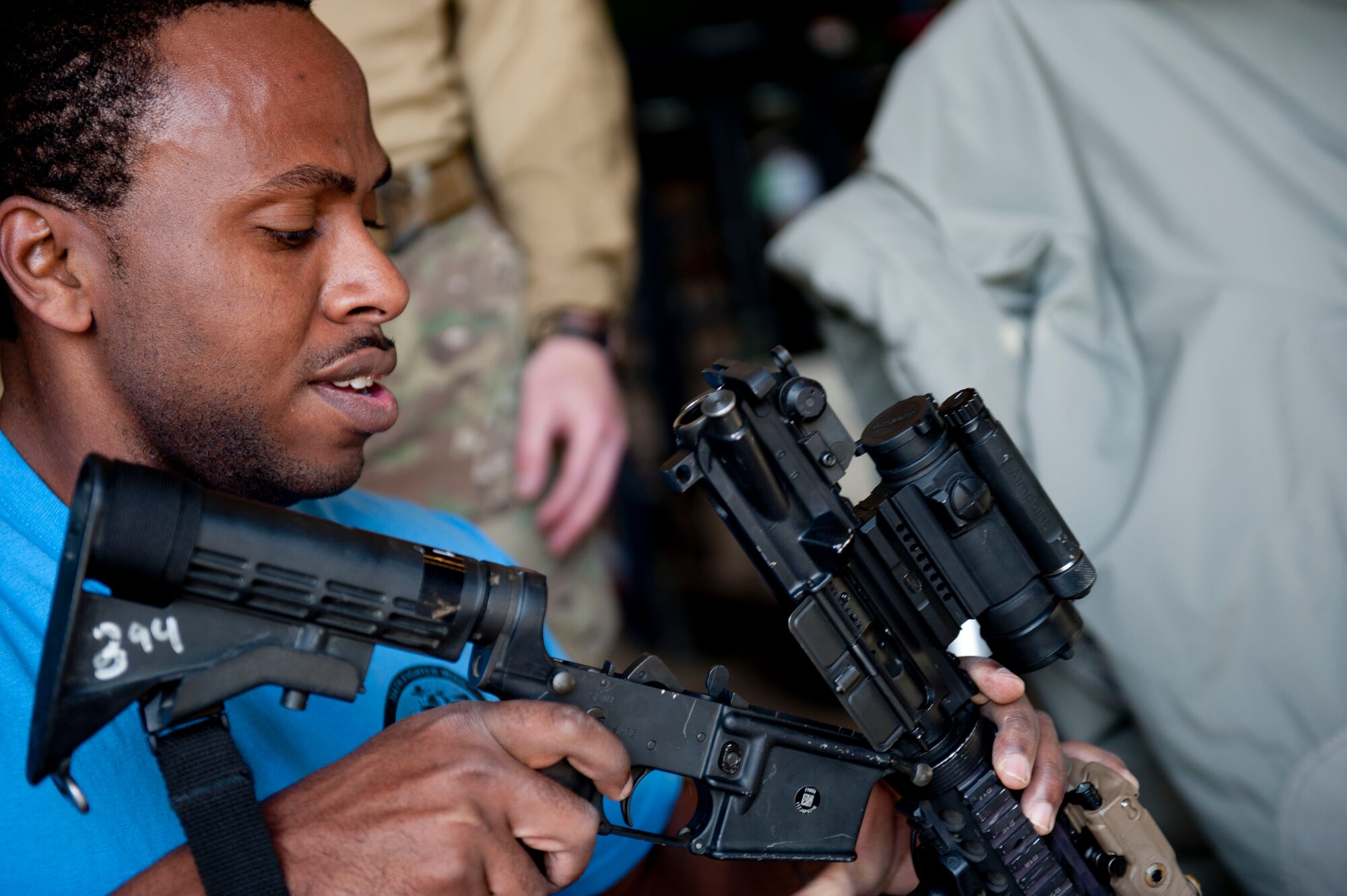 Staff Sgt. Barrett Johnson, 366th Fighter Wing Judge Advocate adverse actions paralegal, reassembles an M4 Carbine as the last challenge presented during the Police Week Defender’s Challenge May 13, 2014, at Mountain Home Air Force Base, Idaho. The challenge included a five-minute warm up of burpees and pull ups, circuit training, a dummy carry, and weapons disassembly and reassembly. (U.S. Air Force photo by Airman 1st Class Malissa Lott/RELEASED)